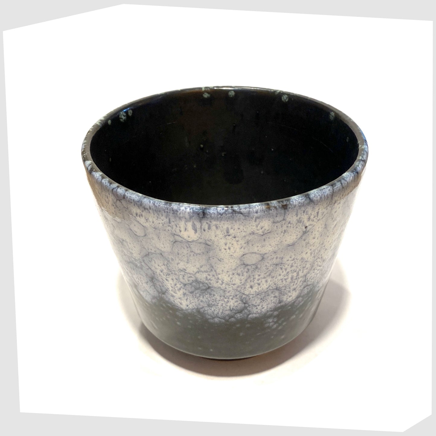 rim and inner glaze on the ES Keramik Planter in dark grey glaze with blue and white fat lava glaze,