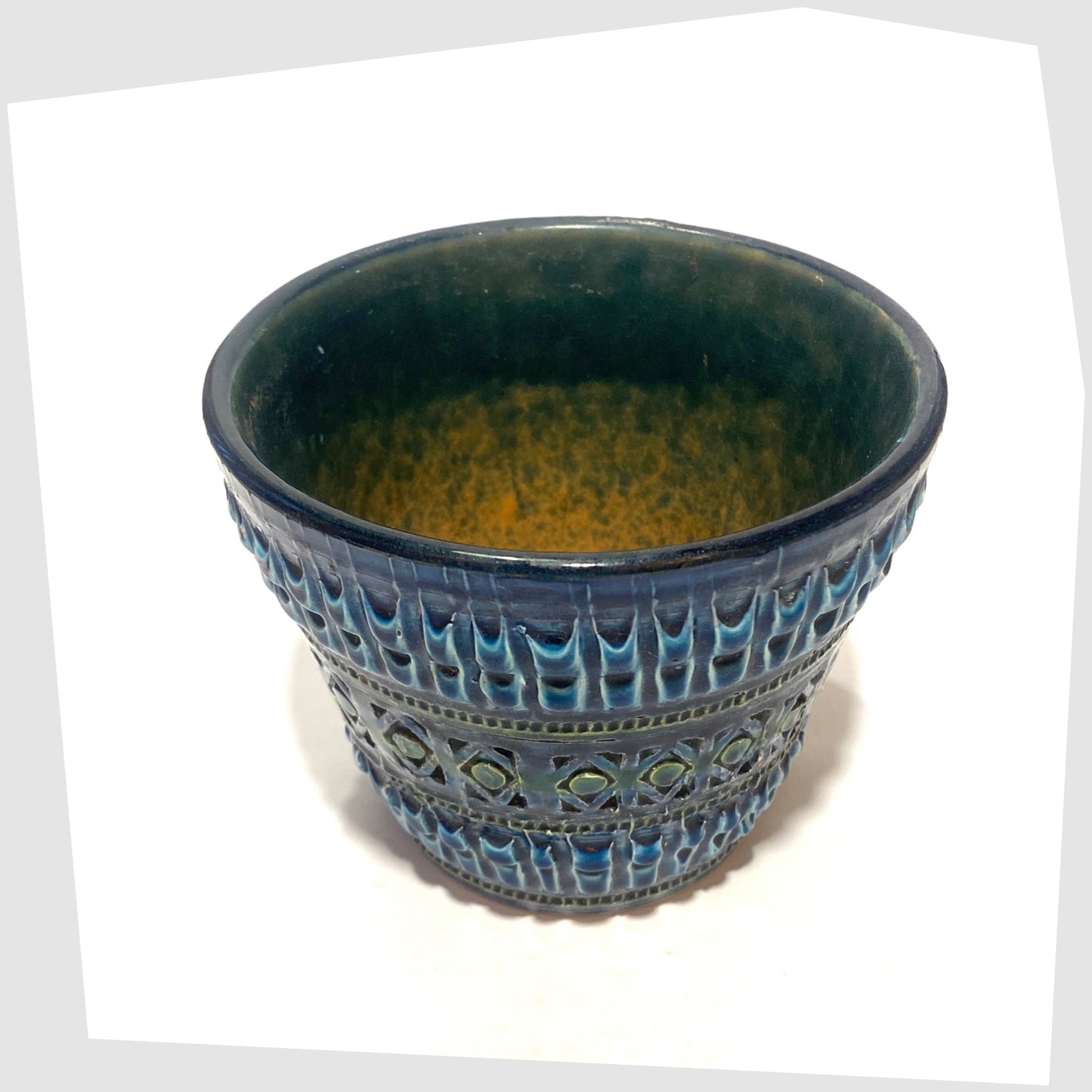Rim and inner glaze of the Italian Pottery Planter in a rich Rimini Blue-inspired glaze with textured impressed patterns, shown on a white background