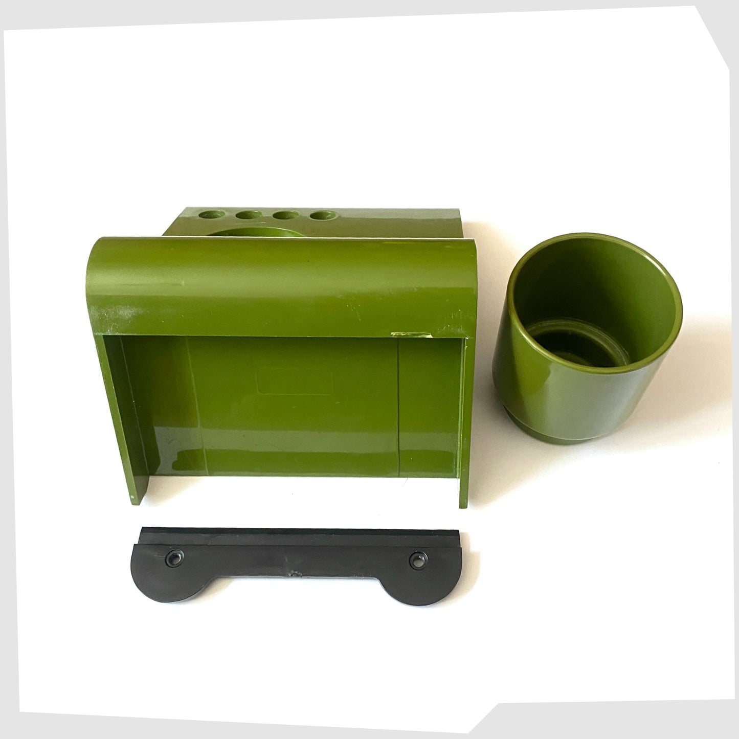 rear of the vintage wall mounted Crayonne Toothbrush Holder in olive green