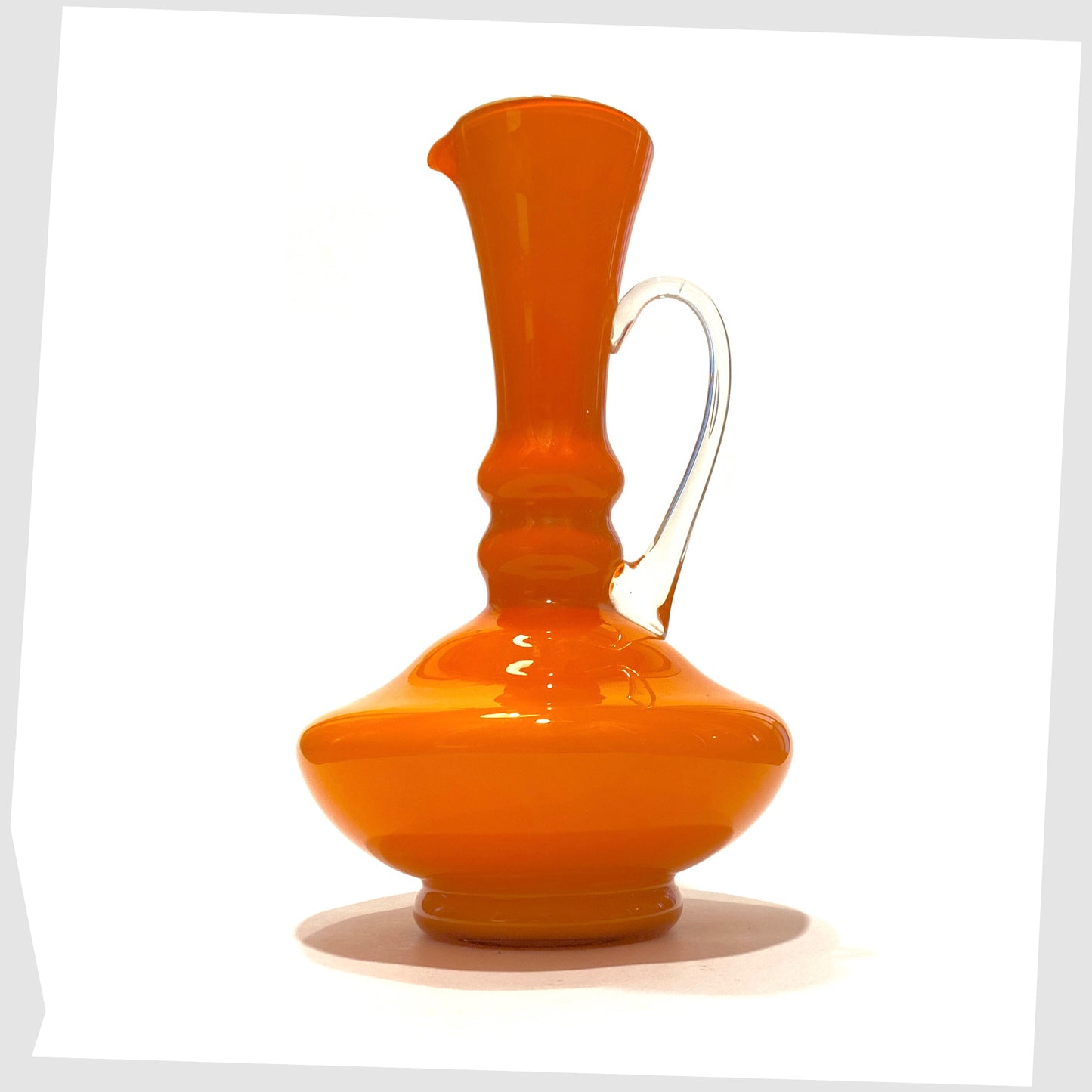 empoli glass jug in vibrant orange cased glass with clear glass handle