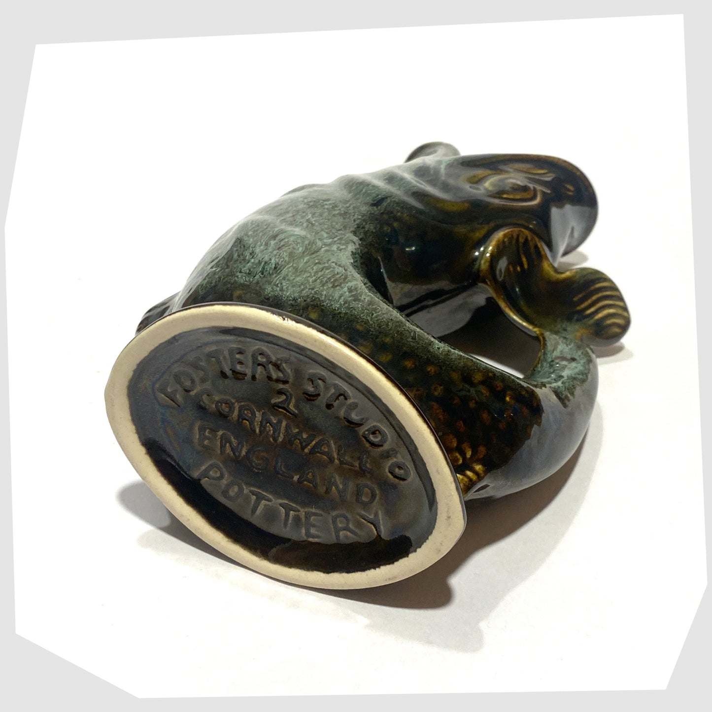 base of the vintage fosters studio pottery gluggle jug in green drip glaze