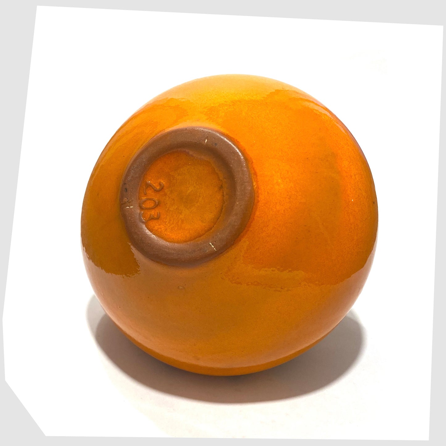 base of the Kreutz Keramik Vase in Orange glaze with black fat lava, marked as model '203'