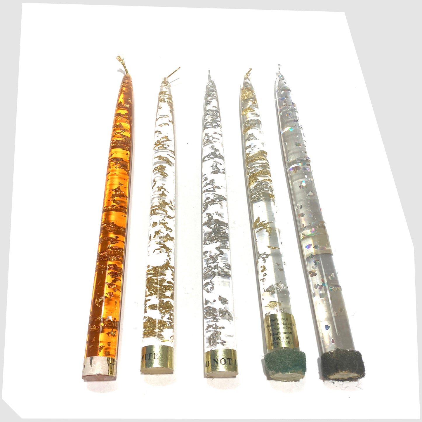 collection of vintage lucite taper candle in clear acrylic with gold and silver flecks