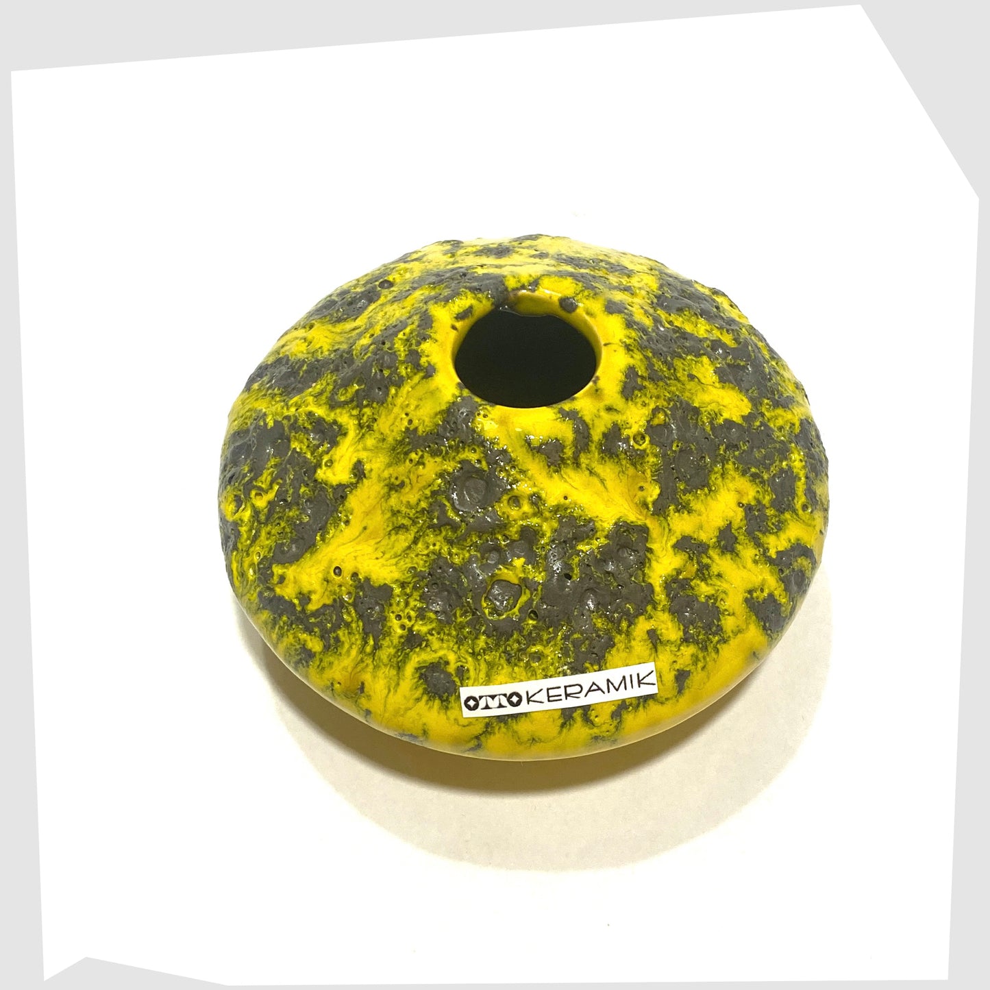 Overhead view of the Otto Keramik 203S Vase in Yellow with grey fat lava glaze