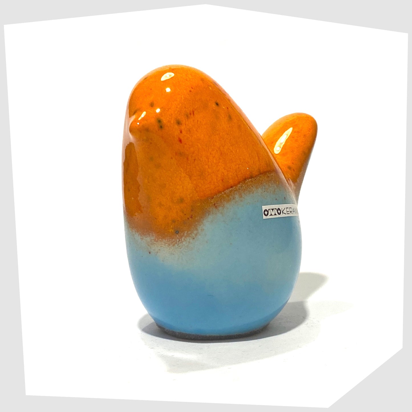 otto keramik ceramic bird sculpture in orange over light blue glaze