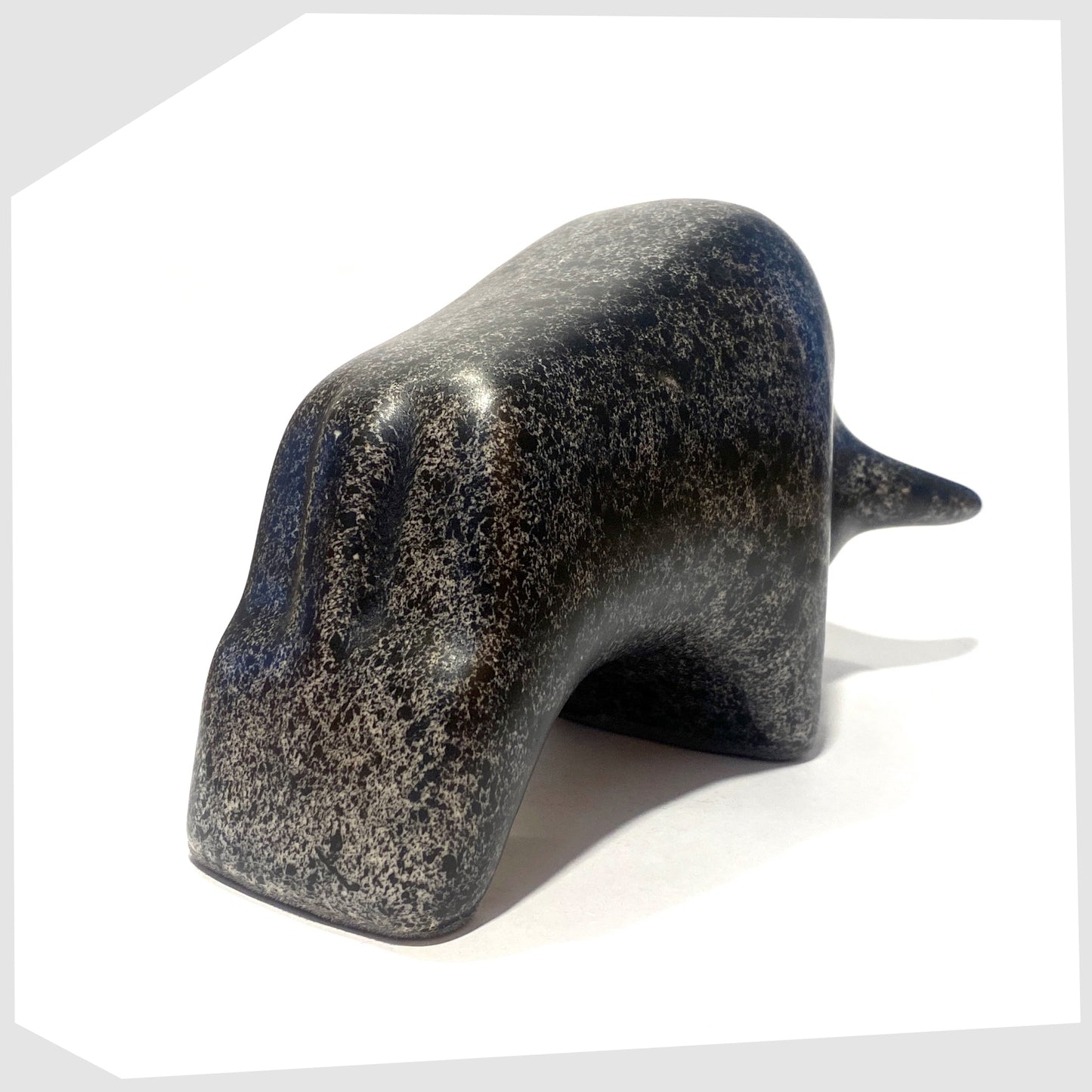 rear of the otto keramik bull in black speckled glaze with cream flecks