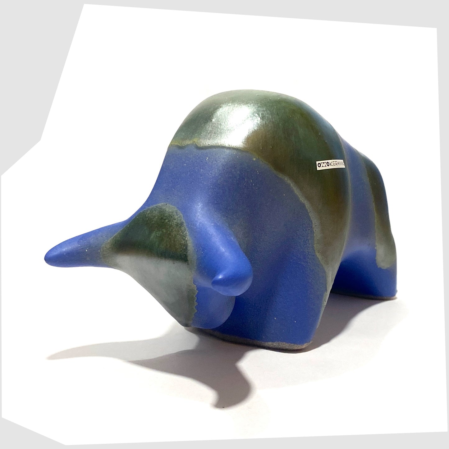 otto keramik bull sculpture glazed in a matte blue with sea green bands