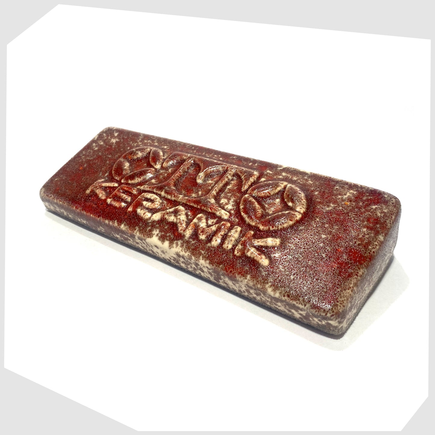 Otto Keramik ceramic display brick in Molten Red speckled glaze
