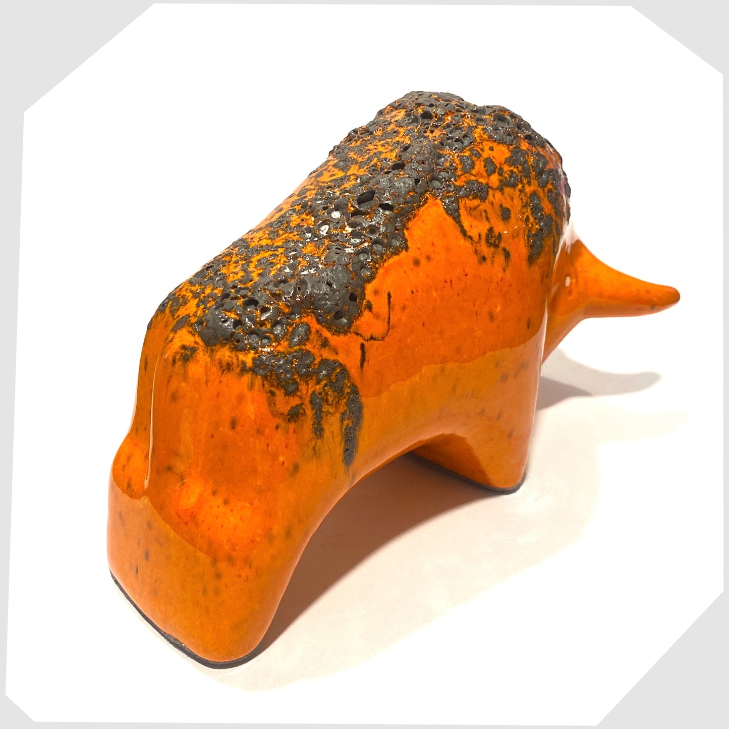 rear of the otto keramik ceramic bull ornament in vibrant orange with dark grey fat lava