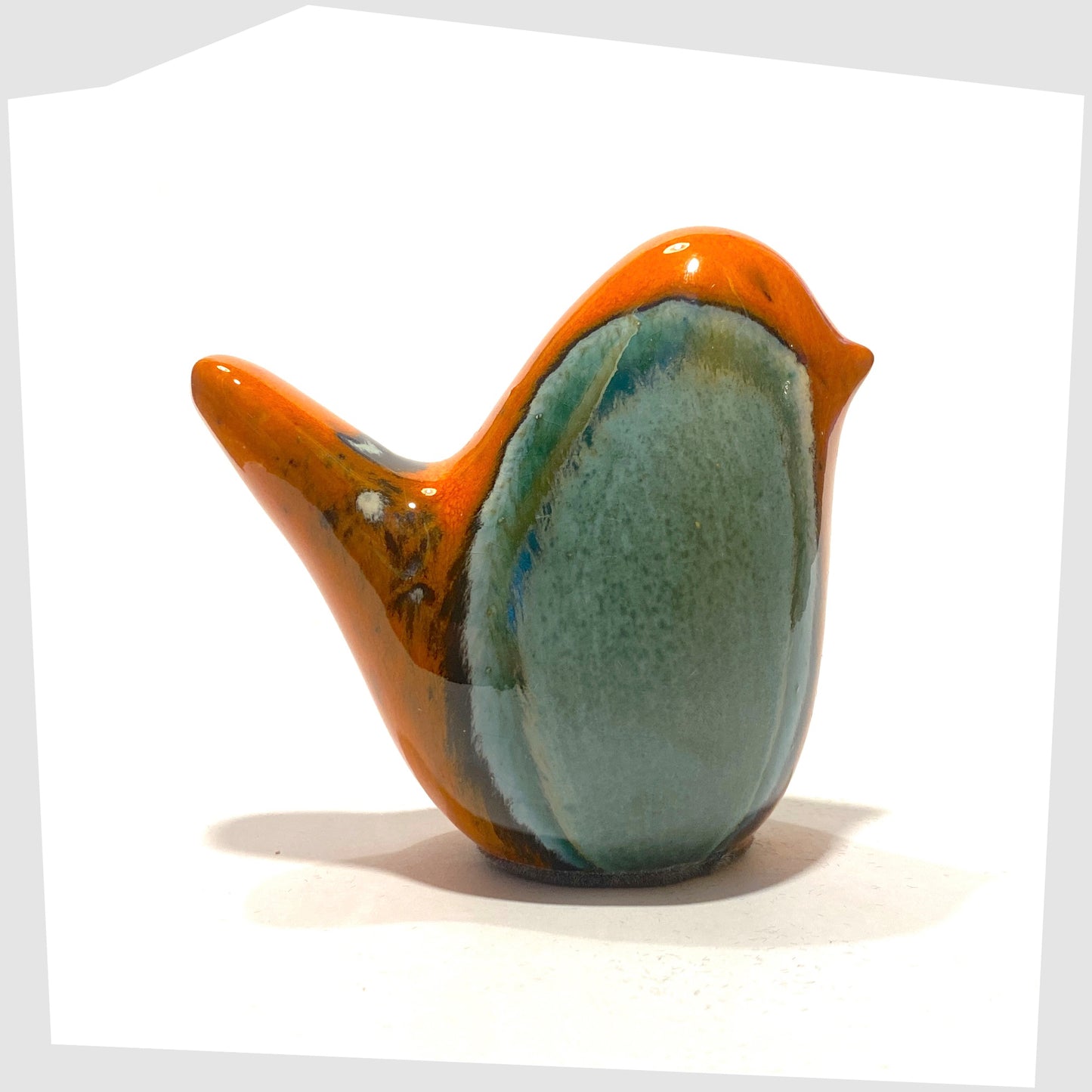 ceramic bird in peru glaze of orange and sea green by otto keramik, germany