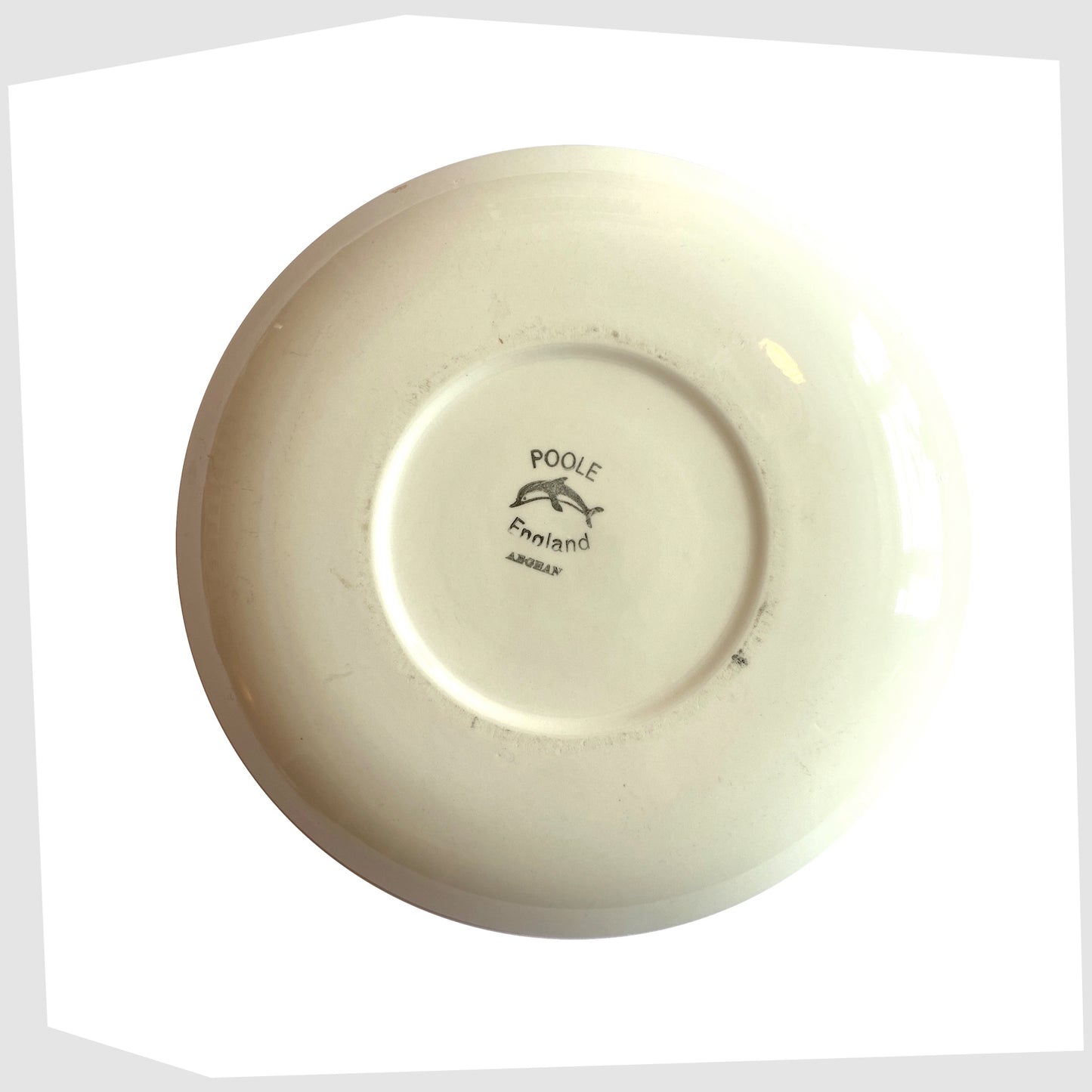 rear of the Poole Pottery Aegean Plate (10" diameter) in a rich yellow glaze with orange and brown circular design