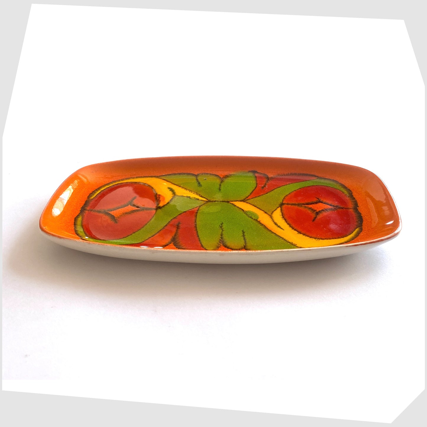 side of the poole pottery delphis pin dish, shape 361, in a rich orange glaze with flowing forms of red green and yellow