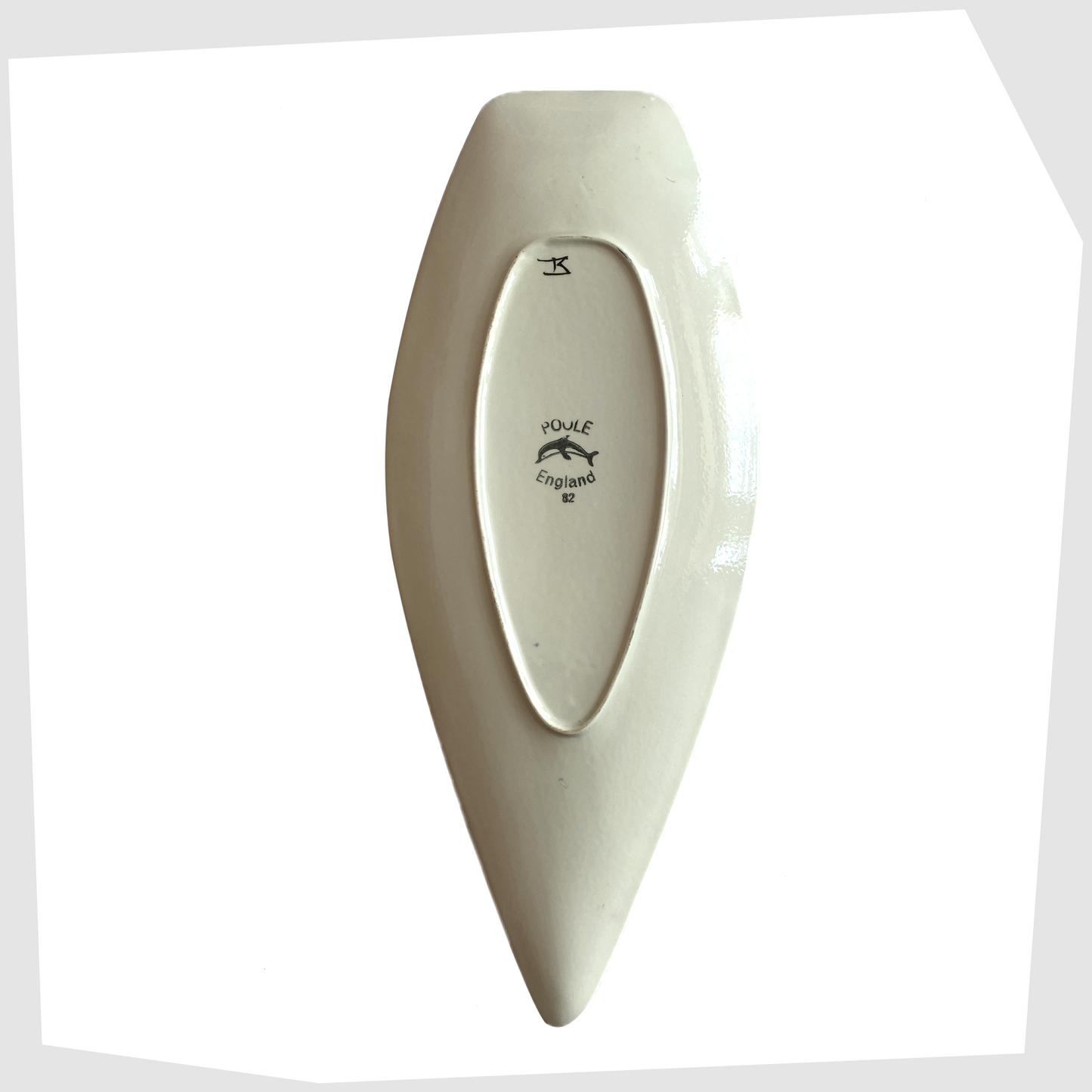 Rear of the Poole Pottery Delphis Spear Dish, Shape 82, by paintress Irene Kerton, shown on a white background