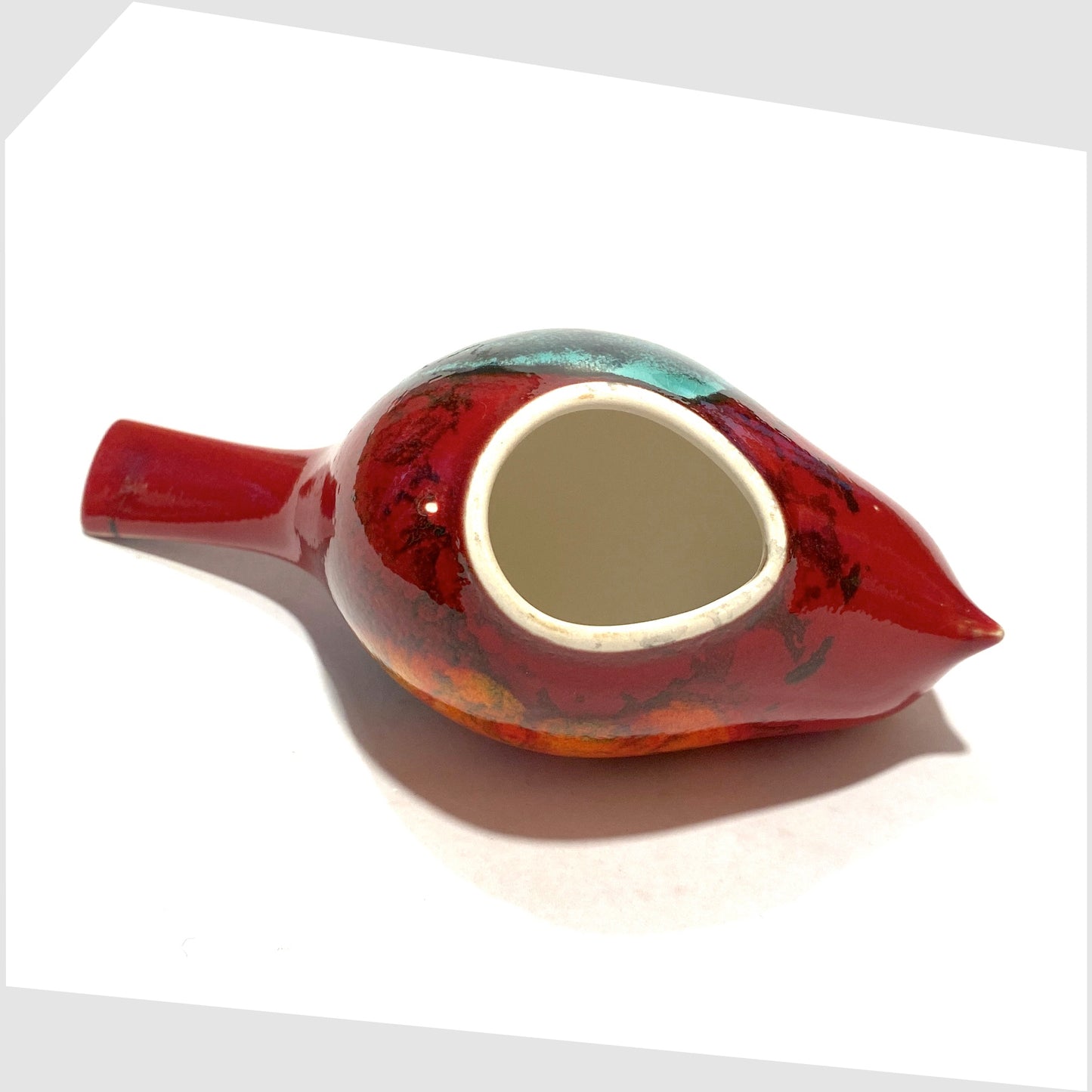 base of the Poole Pottery Pecking Bird in Gemstone glaze of rich red with artistic squares of green, blue, orange and warm grey