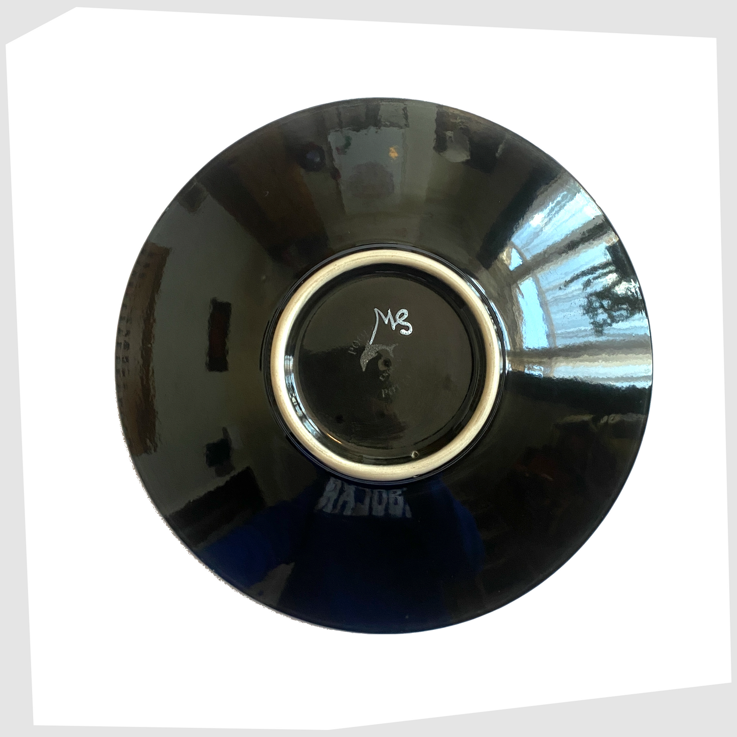 black glazing on the rear of the poole pottery gemstones dish