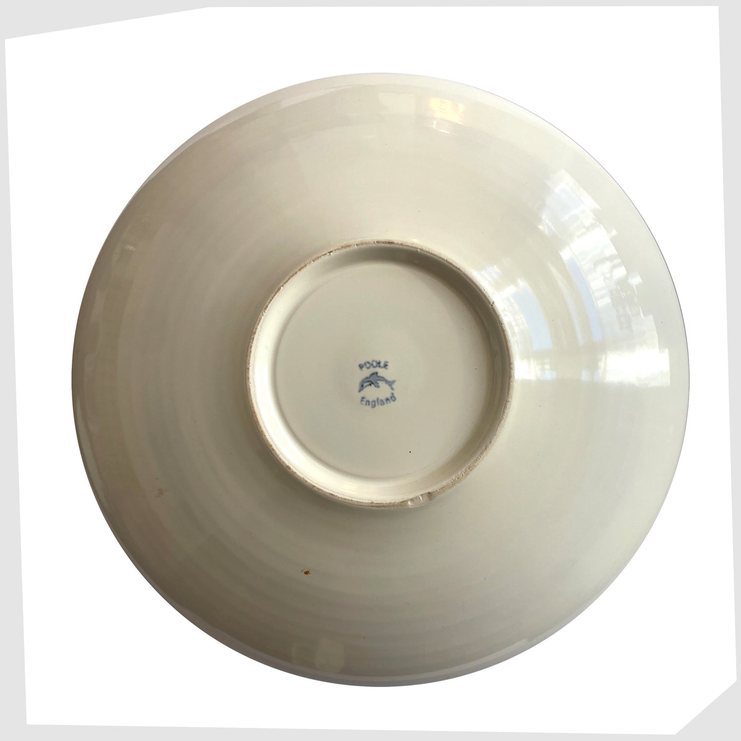 base of the Poole Pottery 11" Bowl in an artistic Delphis glaze of red, cobalt blue and turquoise