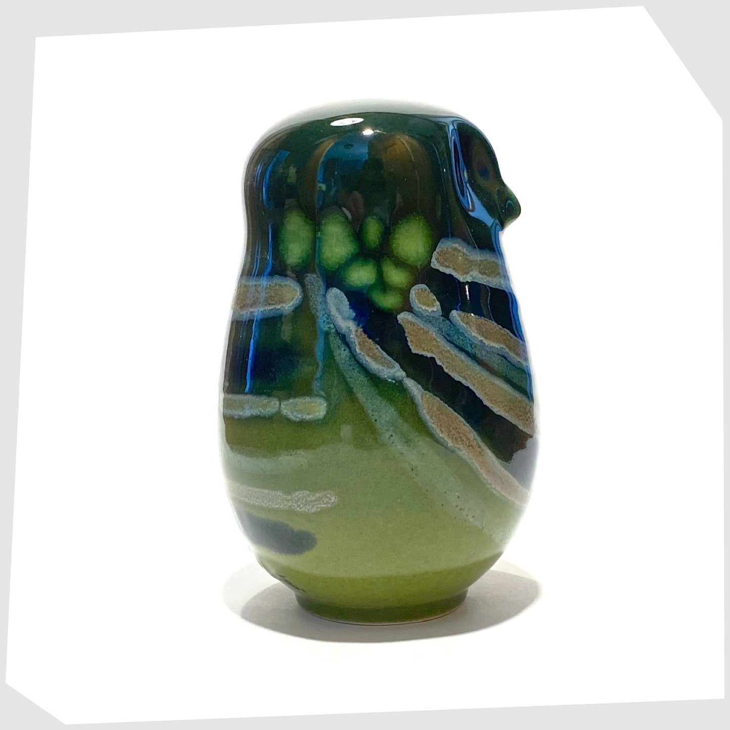 poole pottery owl ornament in the Maya glaze of green, blue and warm grey