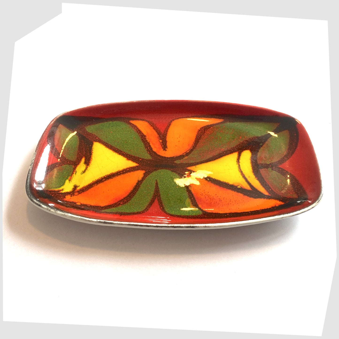 poole pottery decorative plate, glazed in the delphis pattern in vibrant red, green, yellow and orange