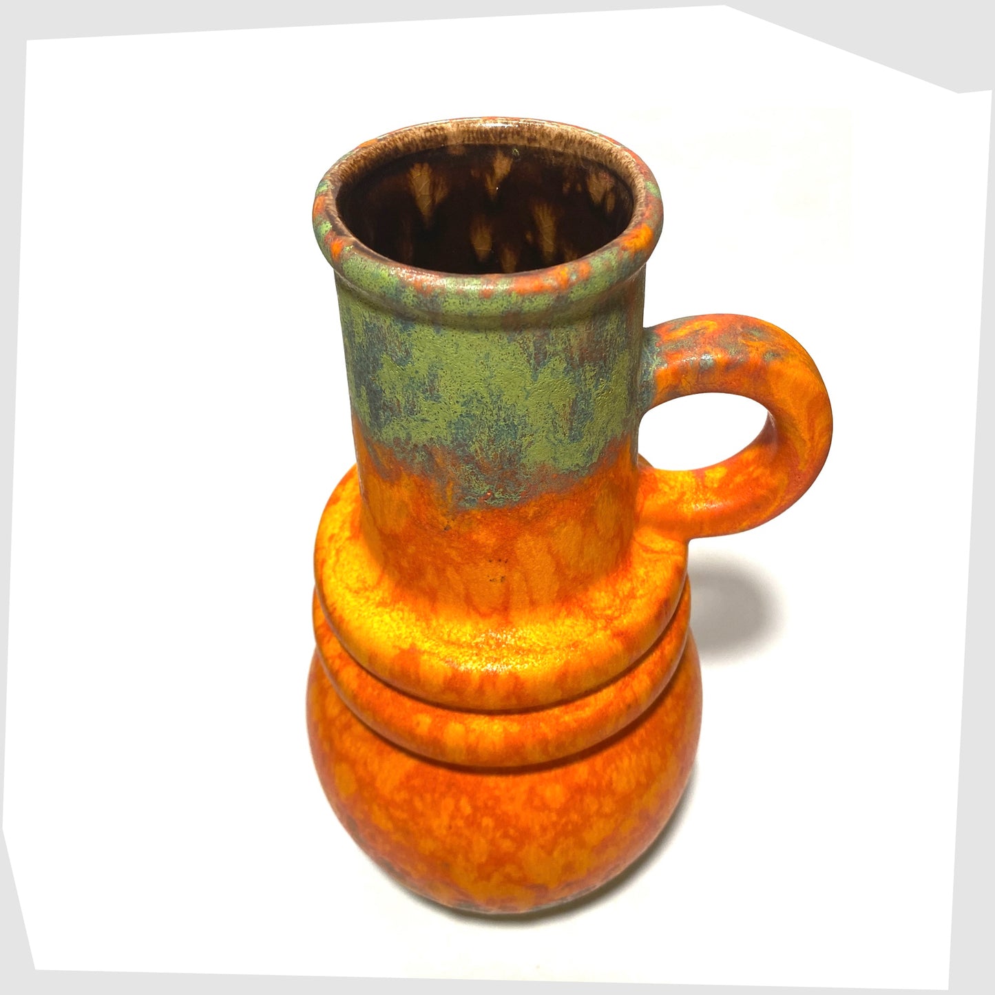 top rim of the scheurich keramik 428-26 vase finished in a volcanic orange glaze with vivid matte green