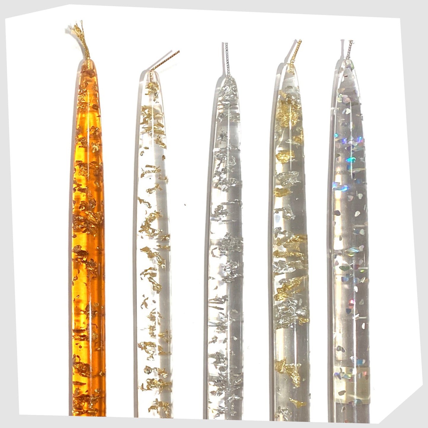 vintage nachtmann lucite candles in orange and clear acrylic lucite with various metal flecks