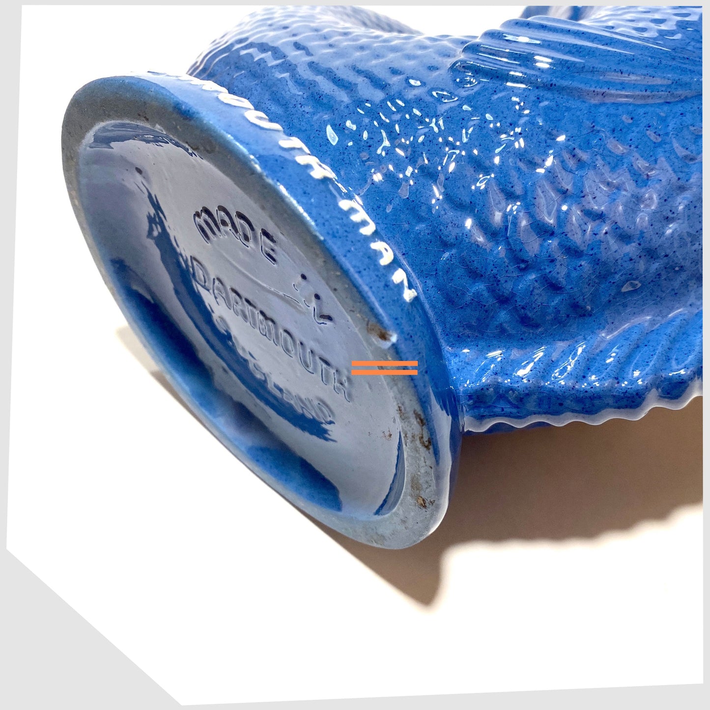 base rim of the Dartmouth Pottery Gluggle Jug in blue glaze with "for a Plymouth man' on the base rim