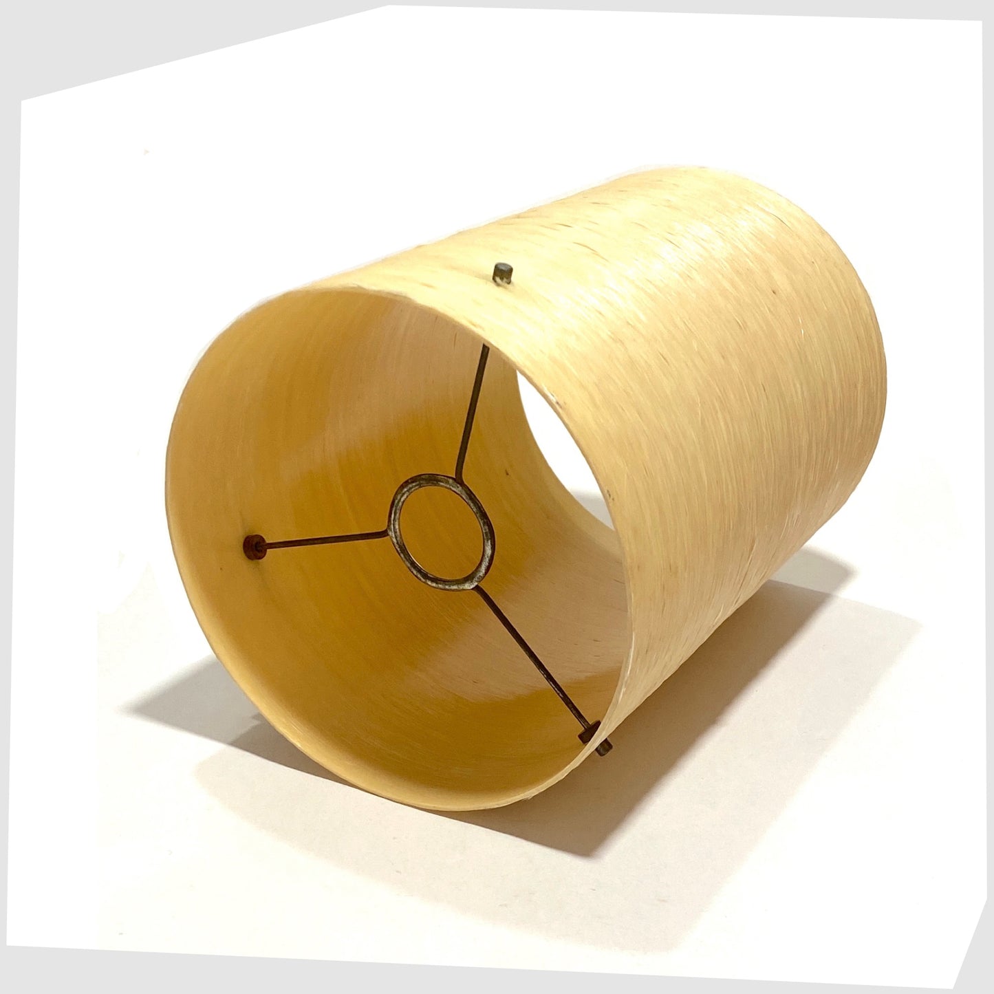 inner fitting of the cylindrical spun fibreglass lampshade in natural base finish