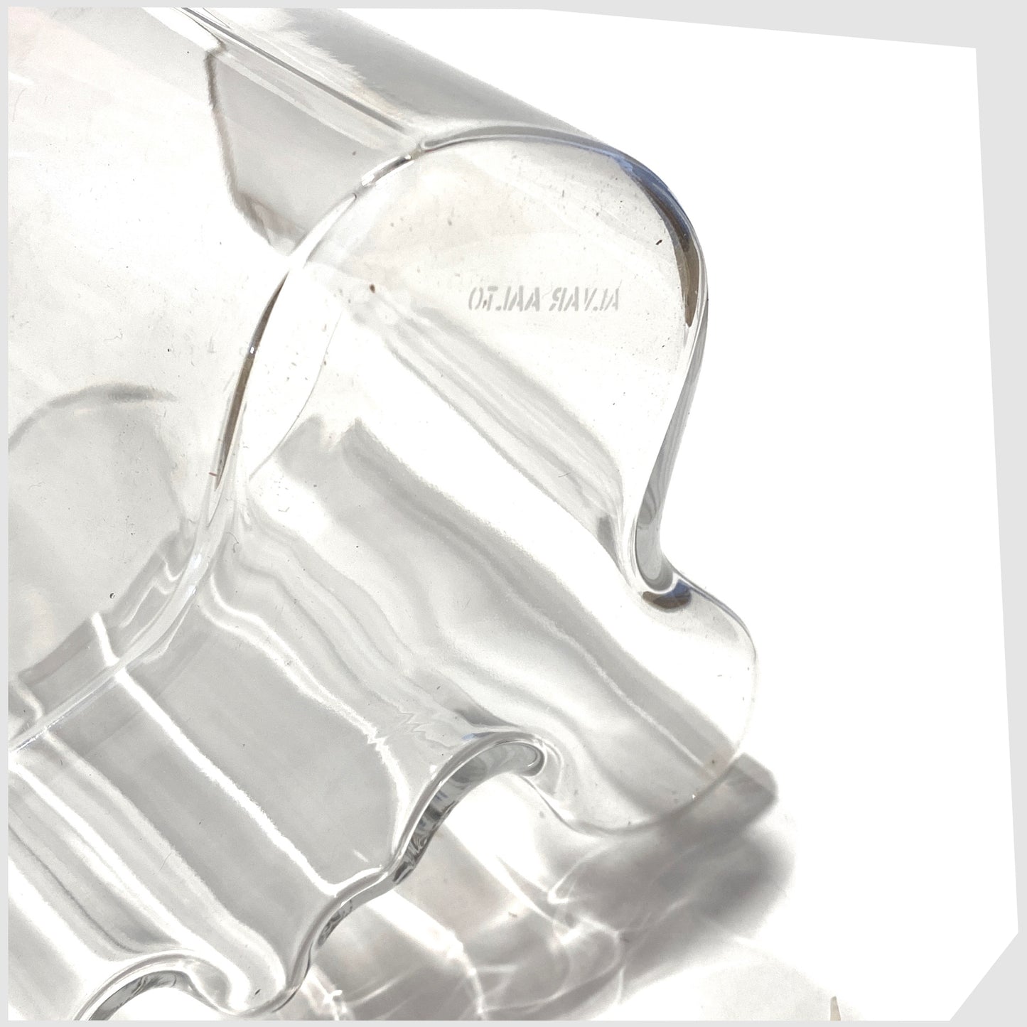 edged name marking on the iittala savoy vase design by Alvar Aalto in clear glass 
