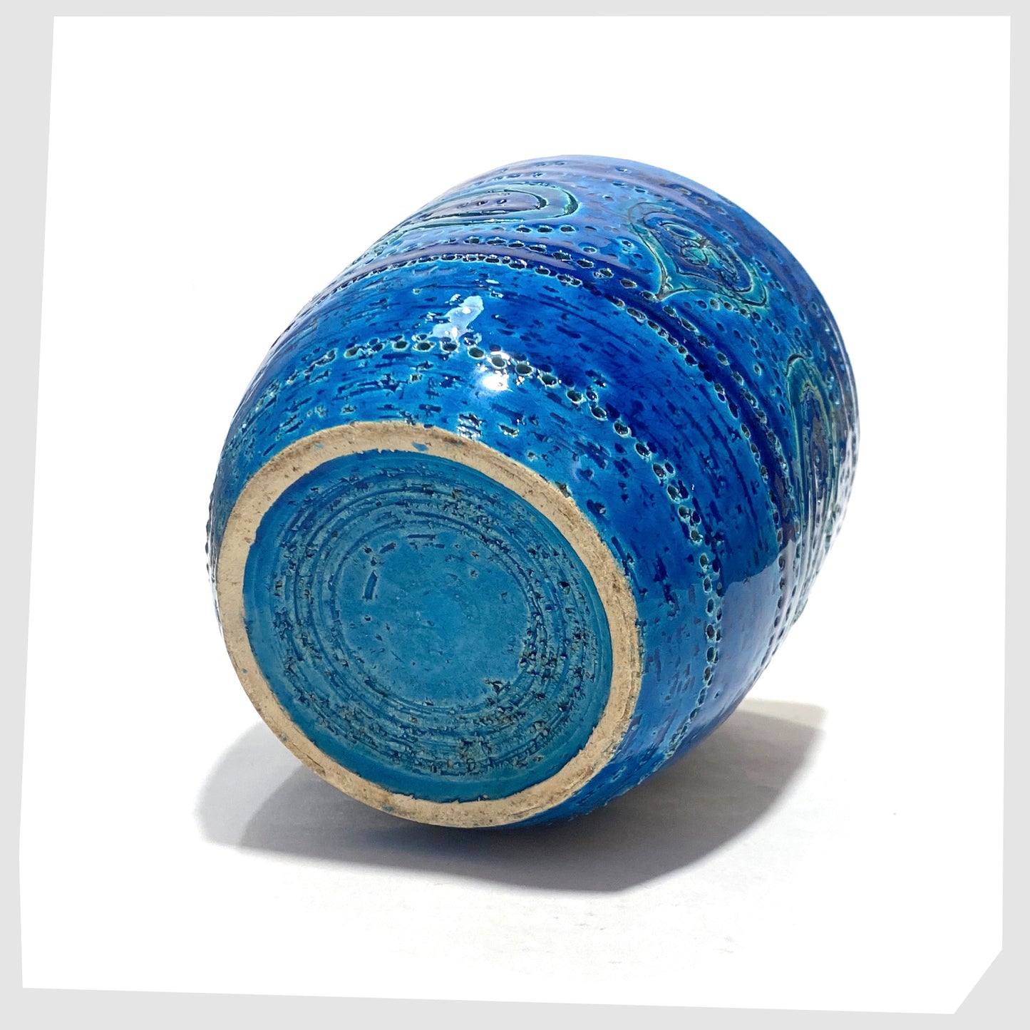 Base of the Bitossi Liberty Planter in rimini blue glaze with flowing paisley pattern shown on a white background
