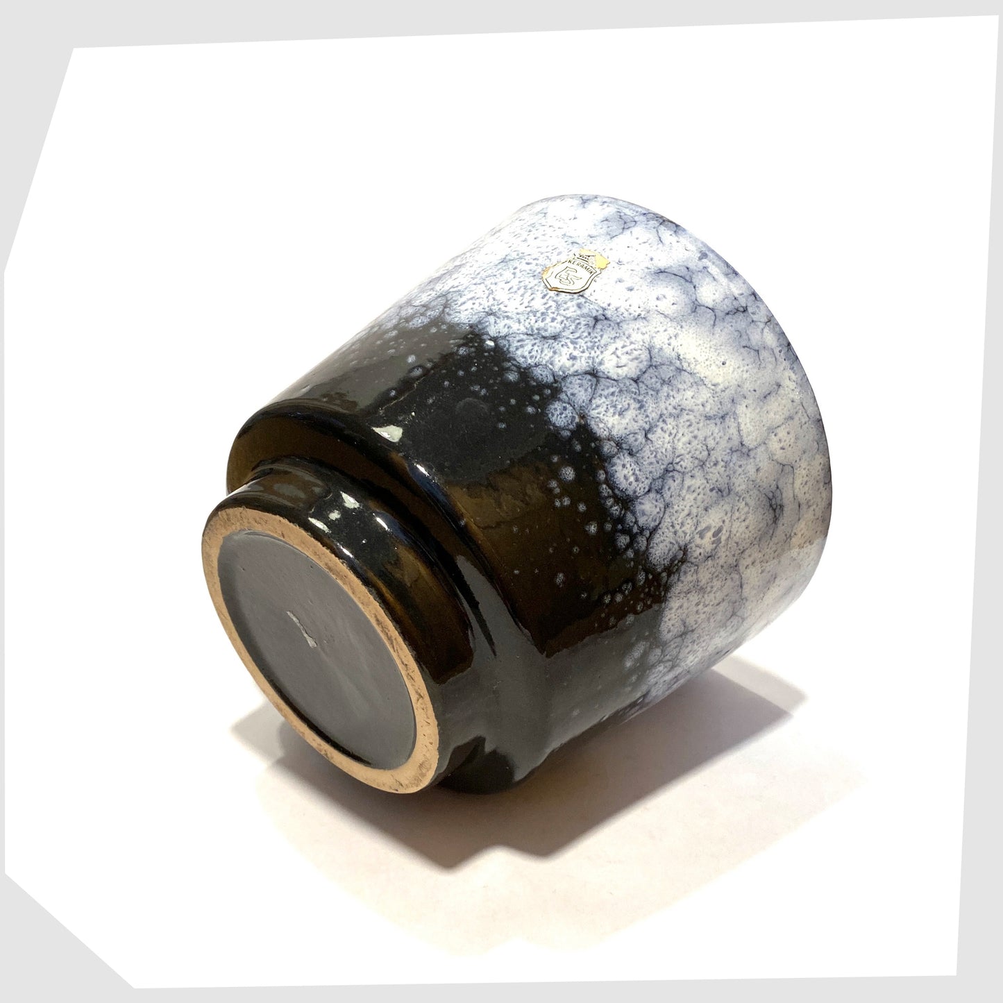 base of the ES Keramik Planter in dark grey glaze with blue and white fat lava glaze
