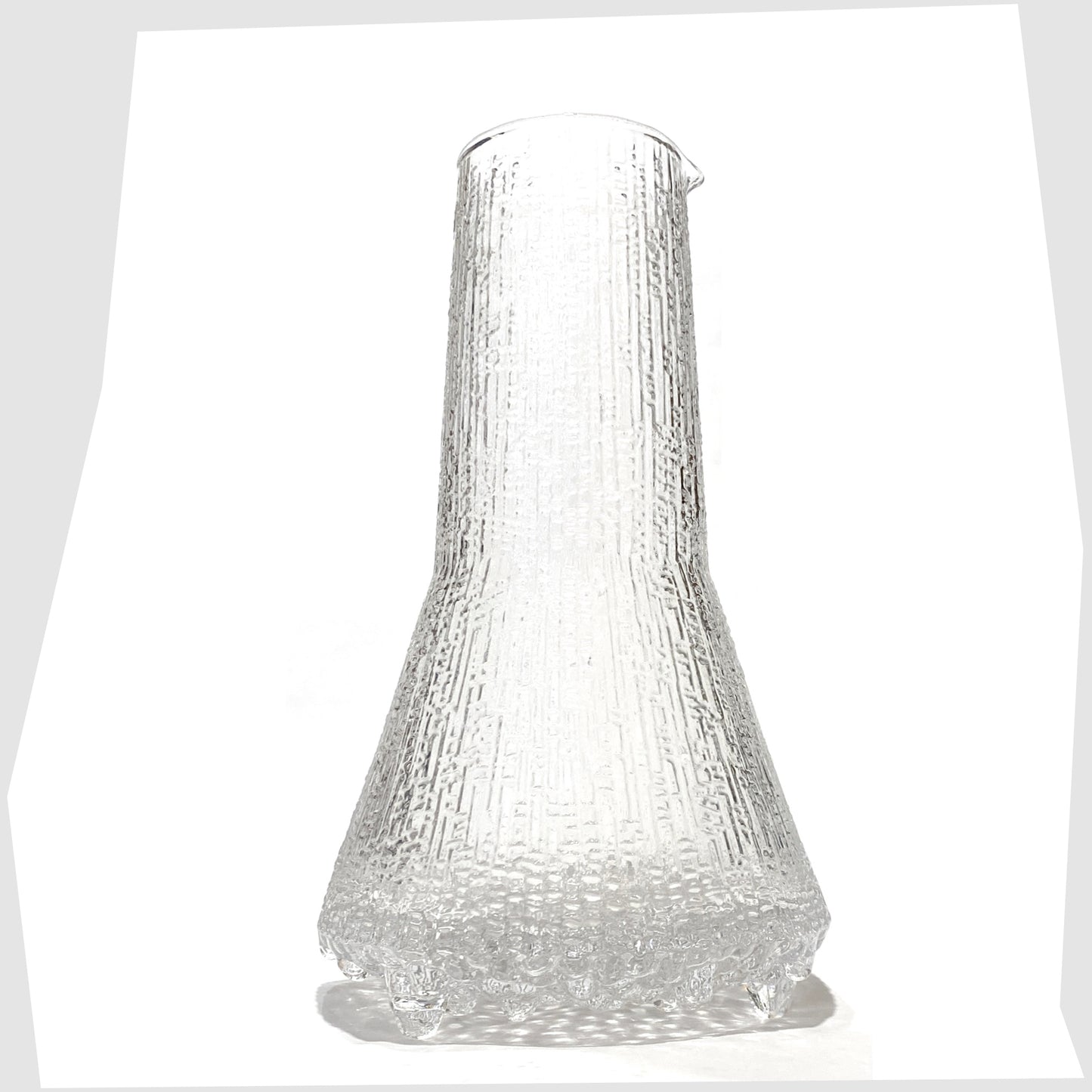 Iittala Ultima Thule Glass Pitcher in clear glass with an ice textured finish, shown on a white background