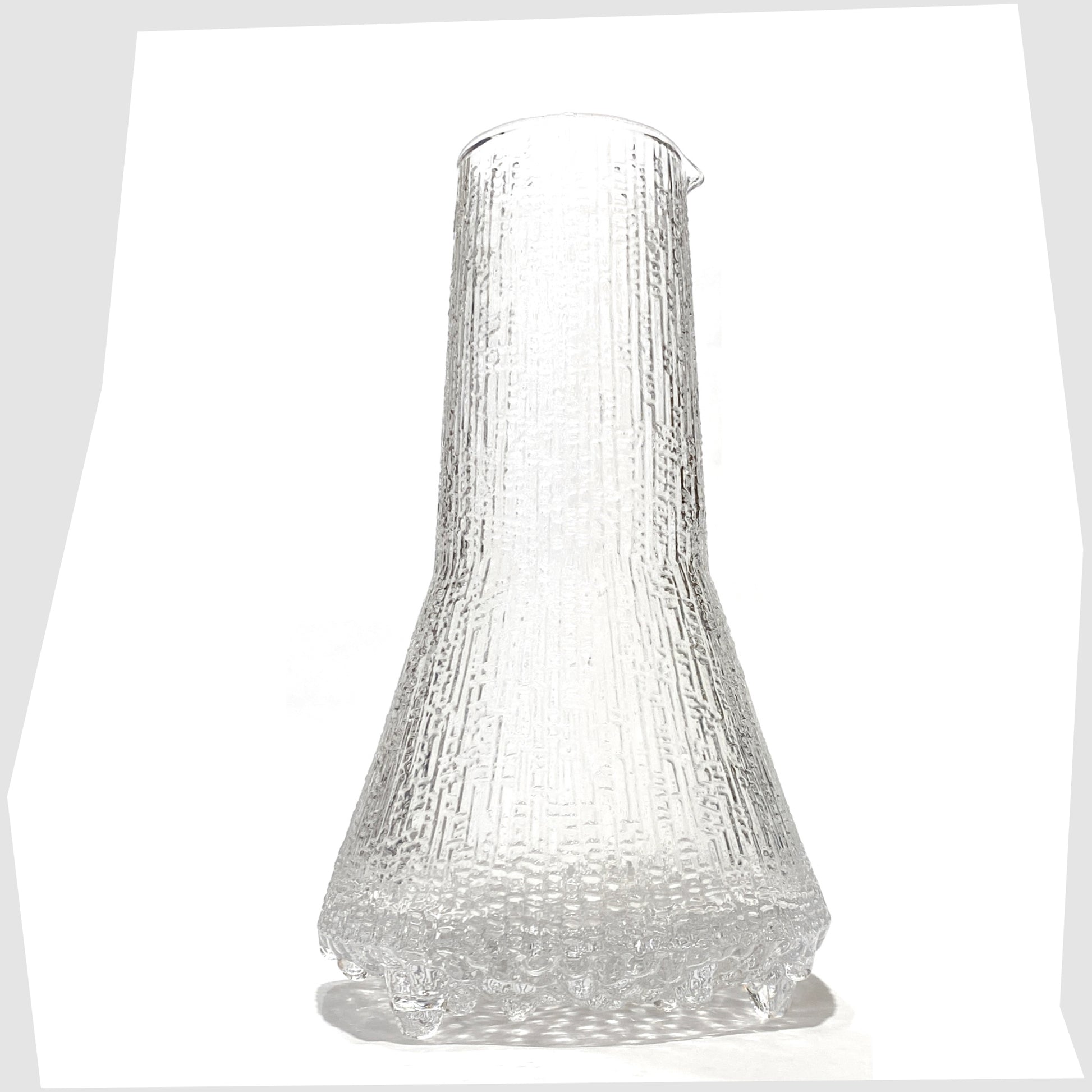Iittala Ultima Thule Glass Pitcher in clear glass with an ice textured finish, shown on a white background