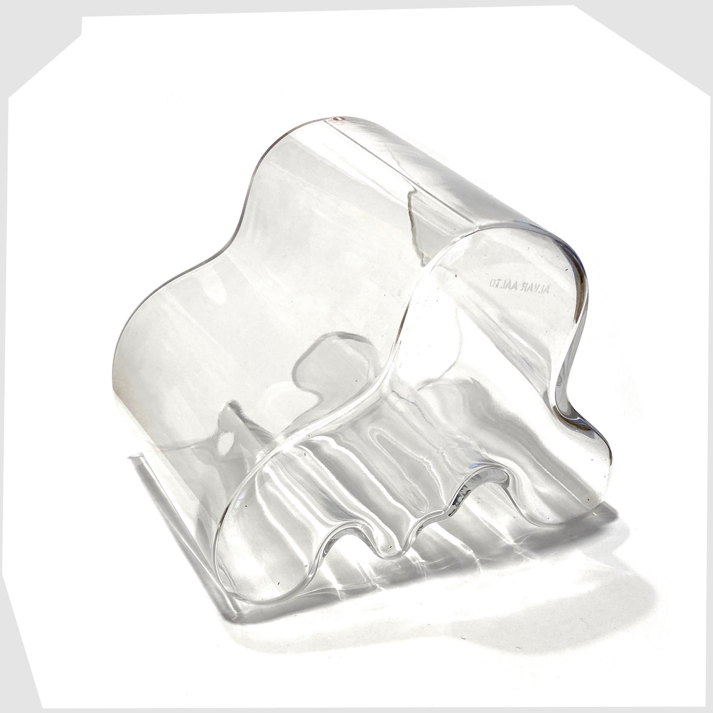 base of the iittala savoy vase designed by Alvar Aalto in clear glass