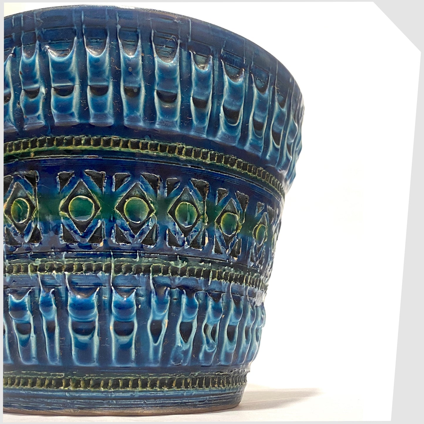 Close up of the Italian Pottery Planter in a rich Rimini Blue-inspired glaze with textured impressed patterns, shown on a white background