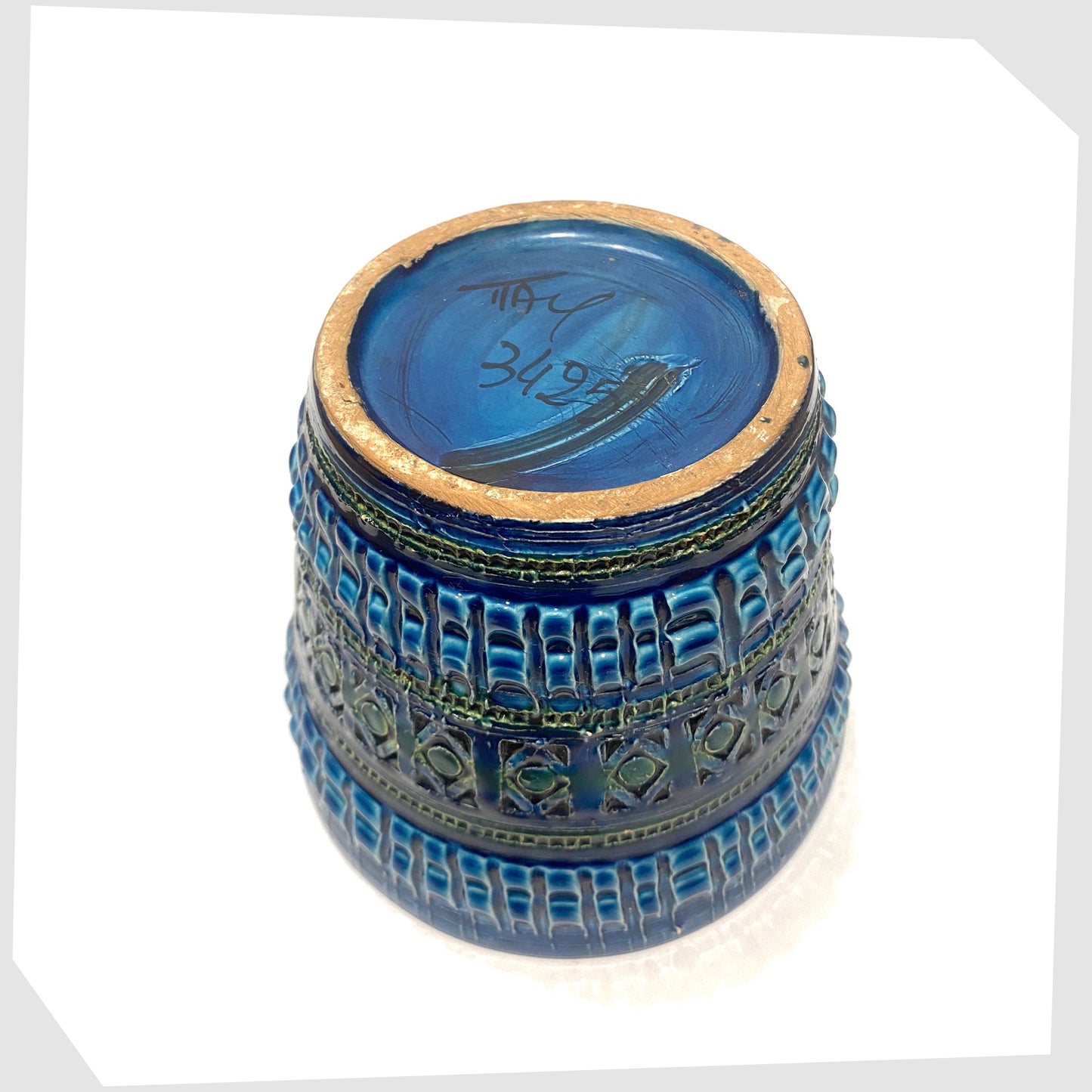 Base of the Italian Pottery Planter in a rich Rimini Blue-inspired glaze with textured impressed patterns, shown on a white background