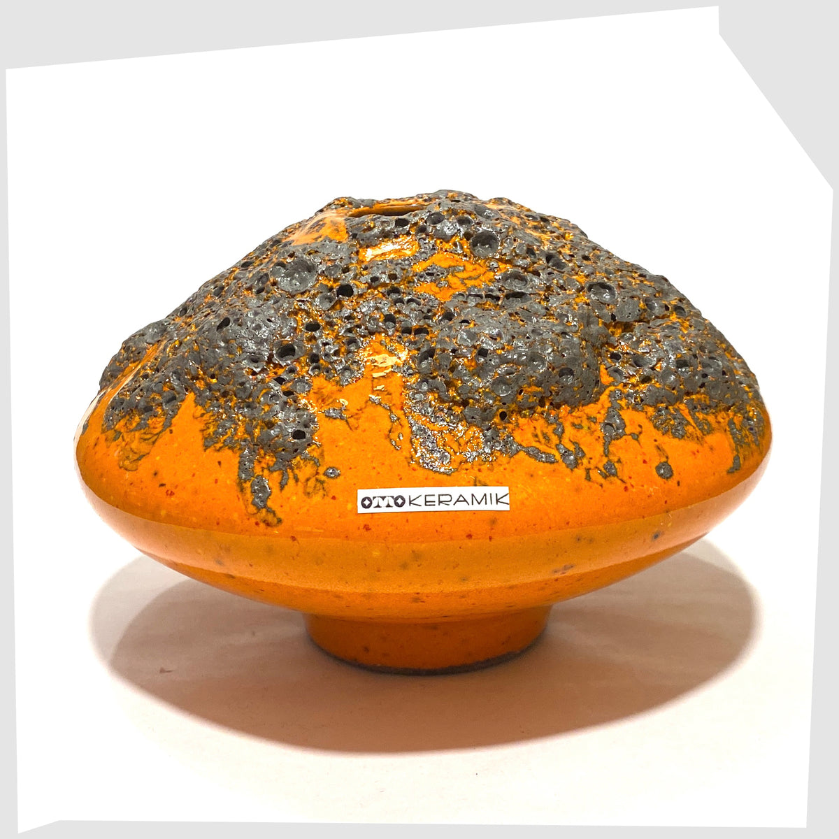 Otto Keramik Vase, model 203, in a vibrant orange glaze with grey fat lava, shown on a white background