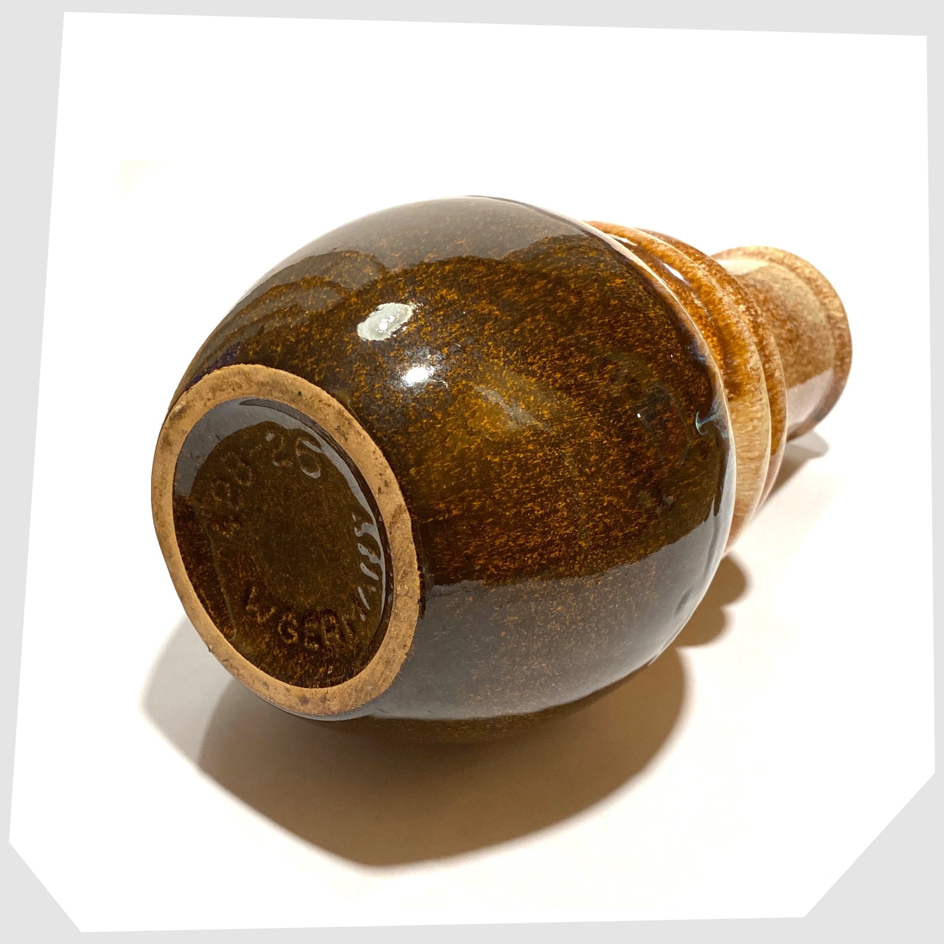 base of the scheurich keramik 428-26 vase in beige and brown glaze with tints of blue 