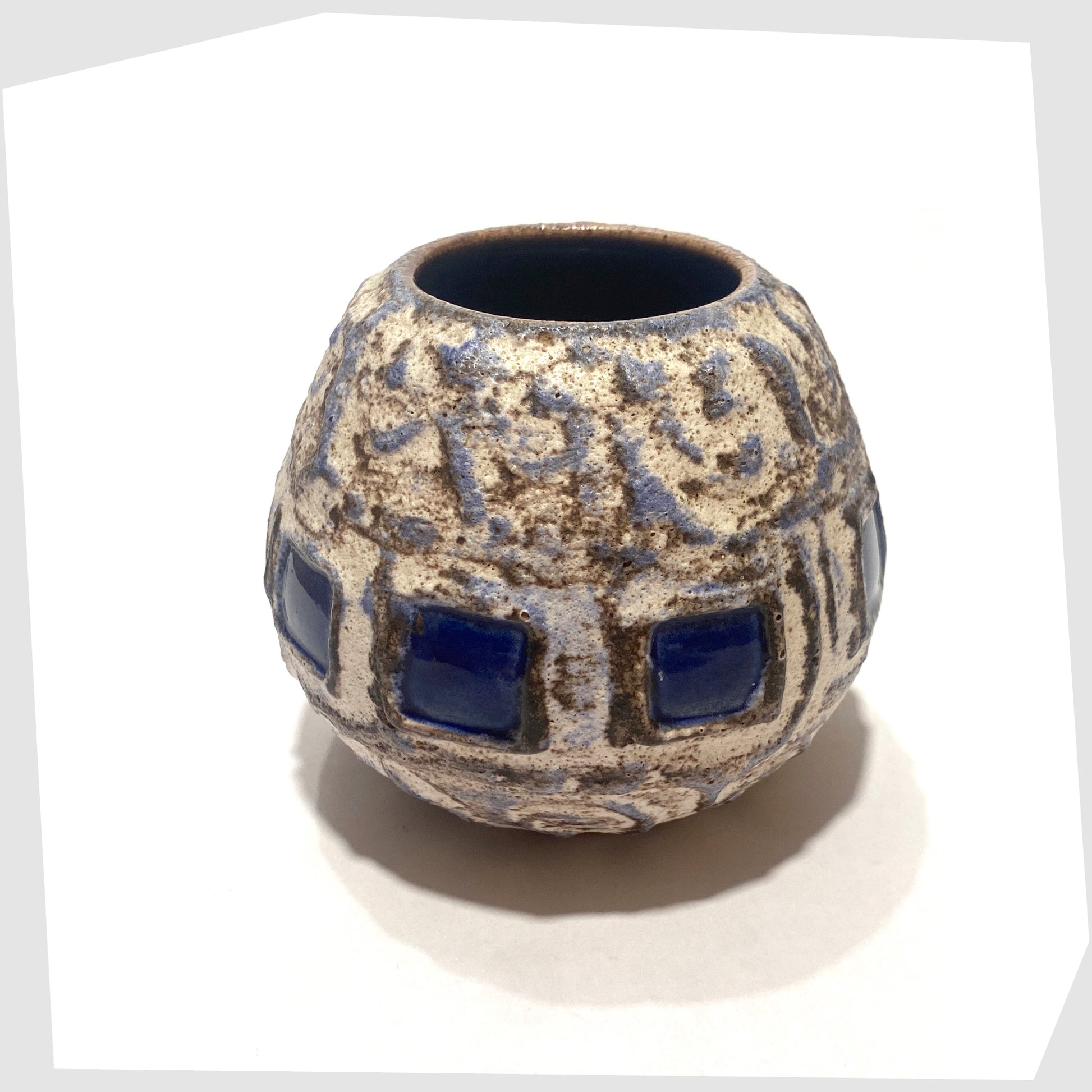 top rim of the Schlossberg Keramik 259 spherical vase in white fat lava glaze with blue squares