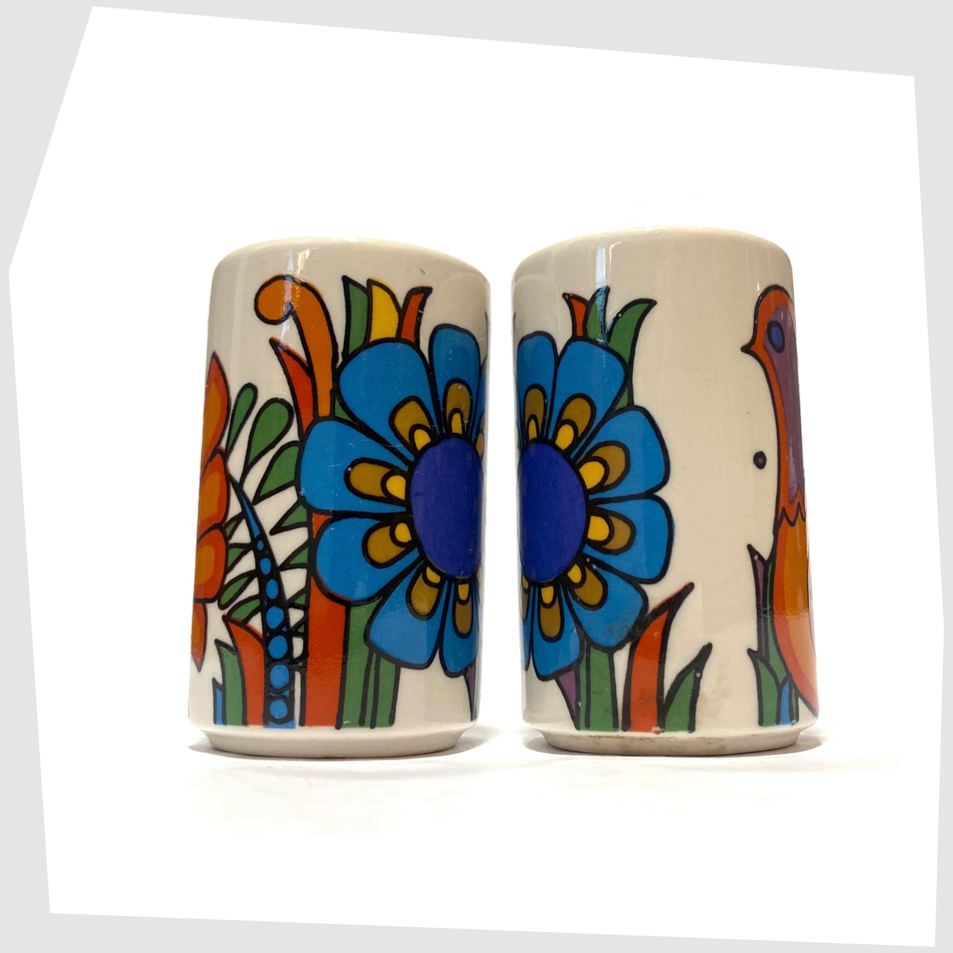 Villeroy and Boch Acapulco Salt & Pepper Shakers showing the full wrap around design of blue flowers, shown on a white background