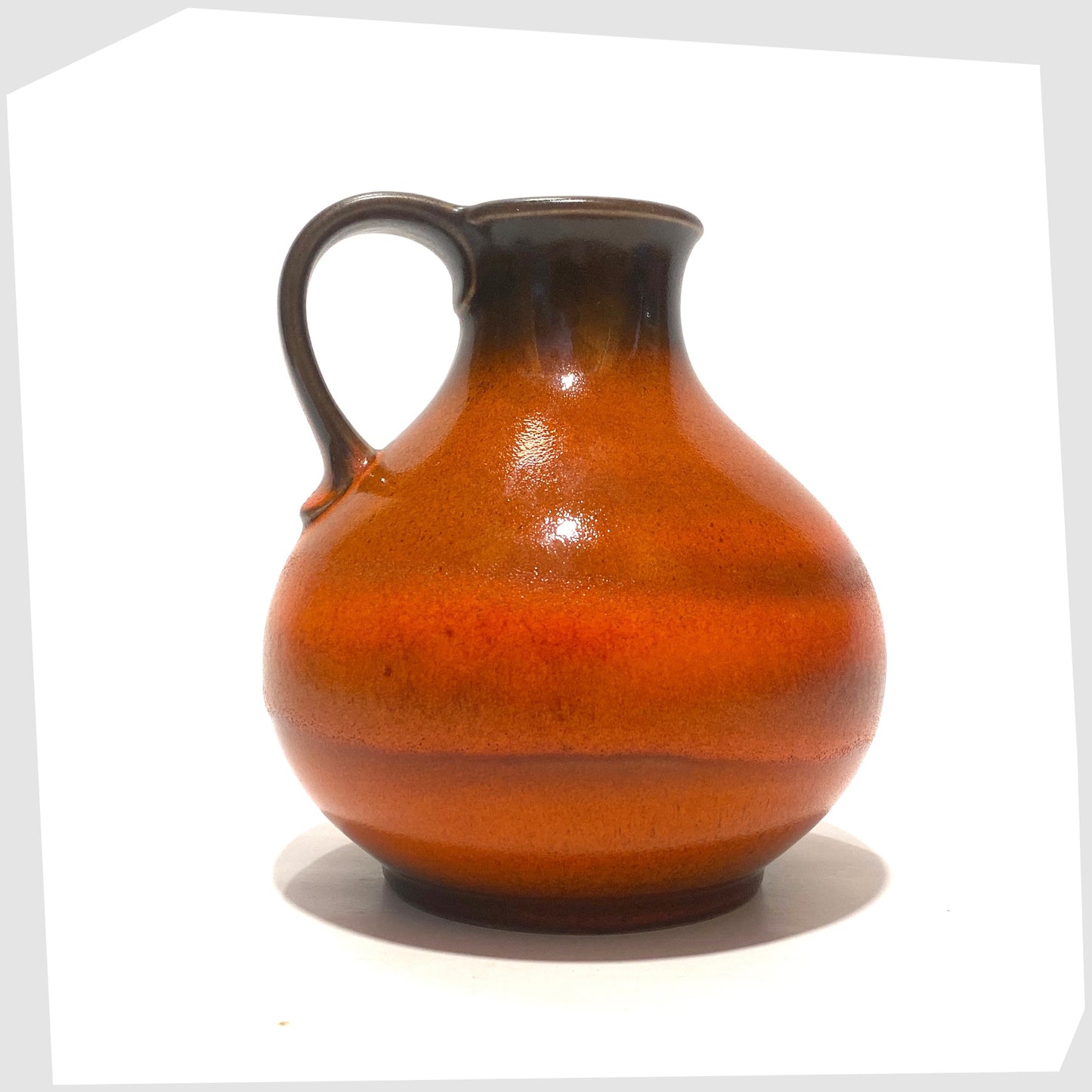 West German Pottery Vase by Steuler Keramik, model 515/15, in a vibrant orange fat lava glaze