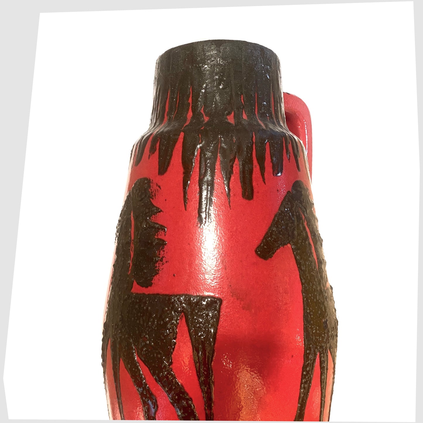 top of the XL scheurich keramik 270-53 floor vase finished in a red glaze with black fat lava horse decoration