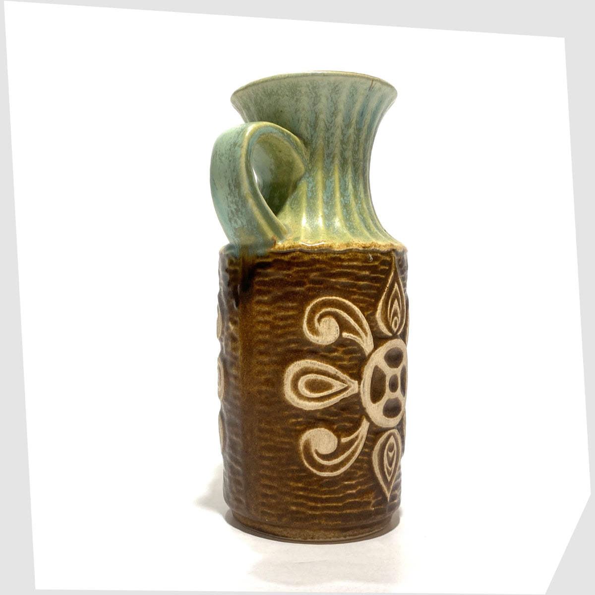 Bay Keramik 69-20 Vase with looped handle and radiating relief design and complimenting green glaze, shown on a white background