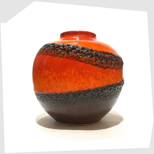 West German Pottery Vase by Bay Keramik, model 64-12, with volcanic red and orange glaze with bands of black fat lava, shown on a white background