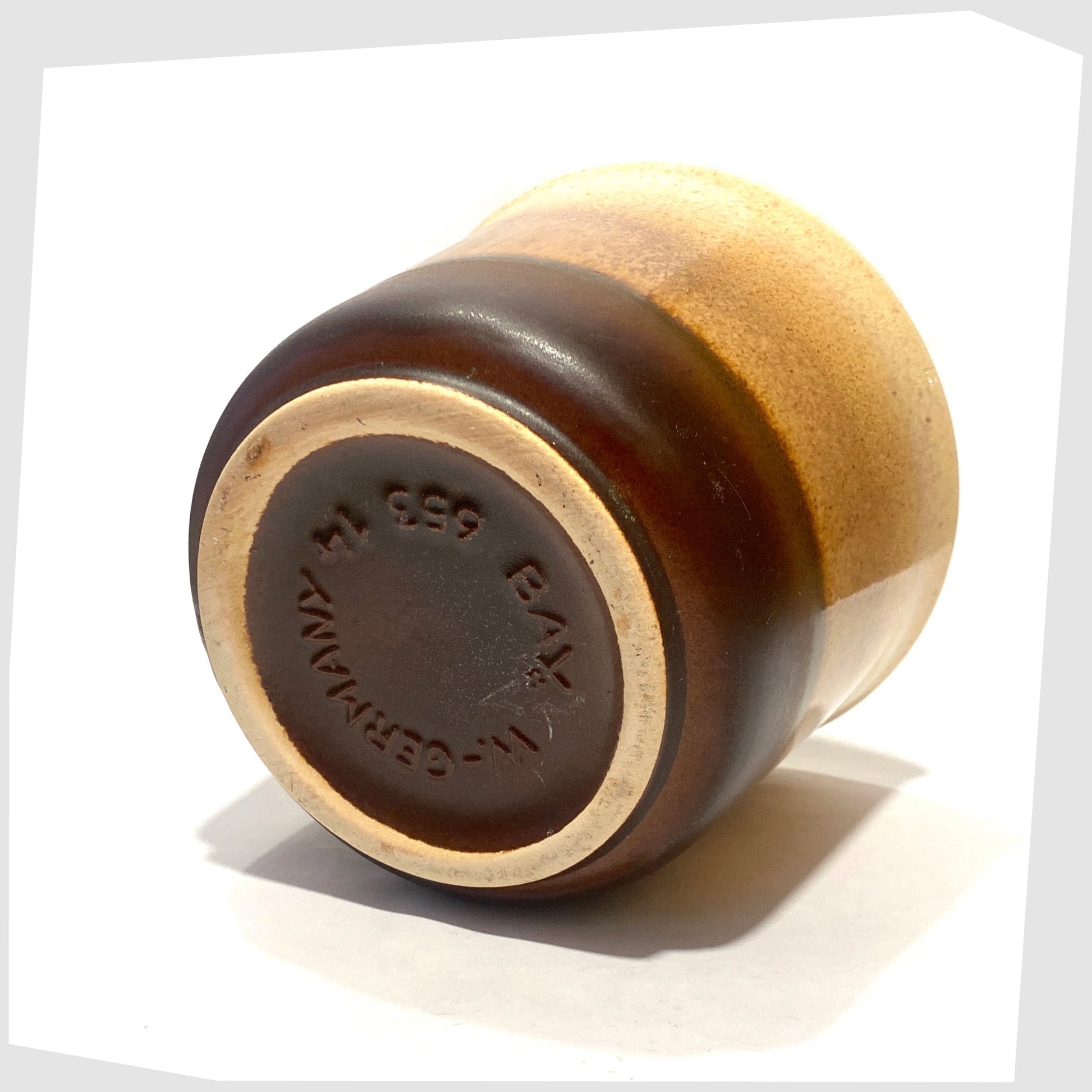 Base of the Bay Keramik 653-14 Planter in amber and brown glaze, shown on a white background