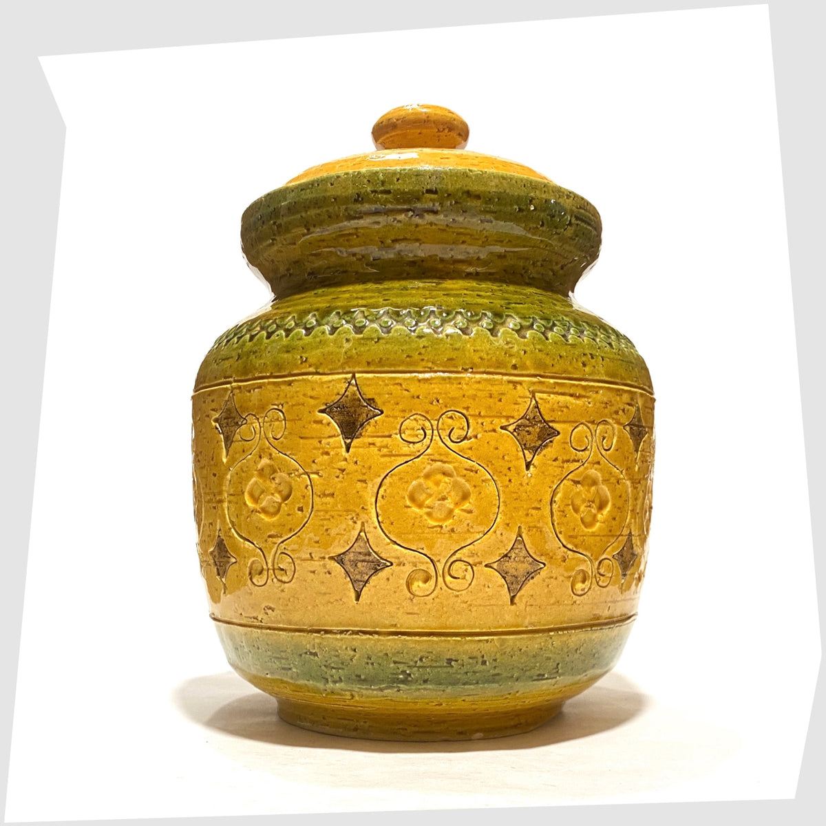 Bitossi Arabesque Lidded Jar in yellow glaze with green bands and impressed markings, shown on a white background