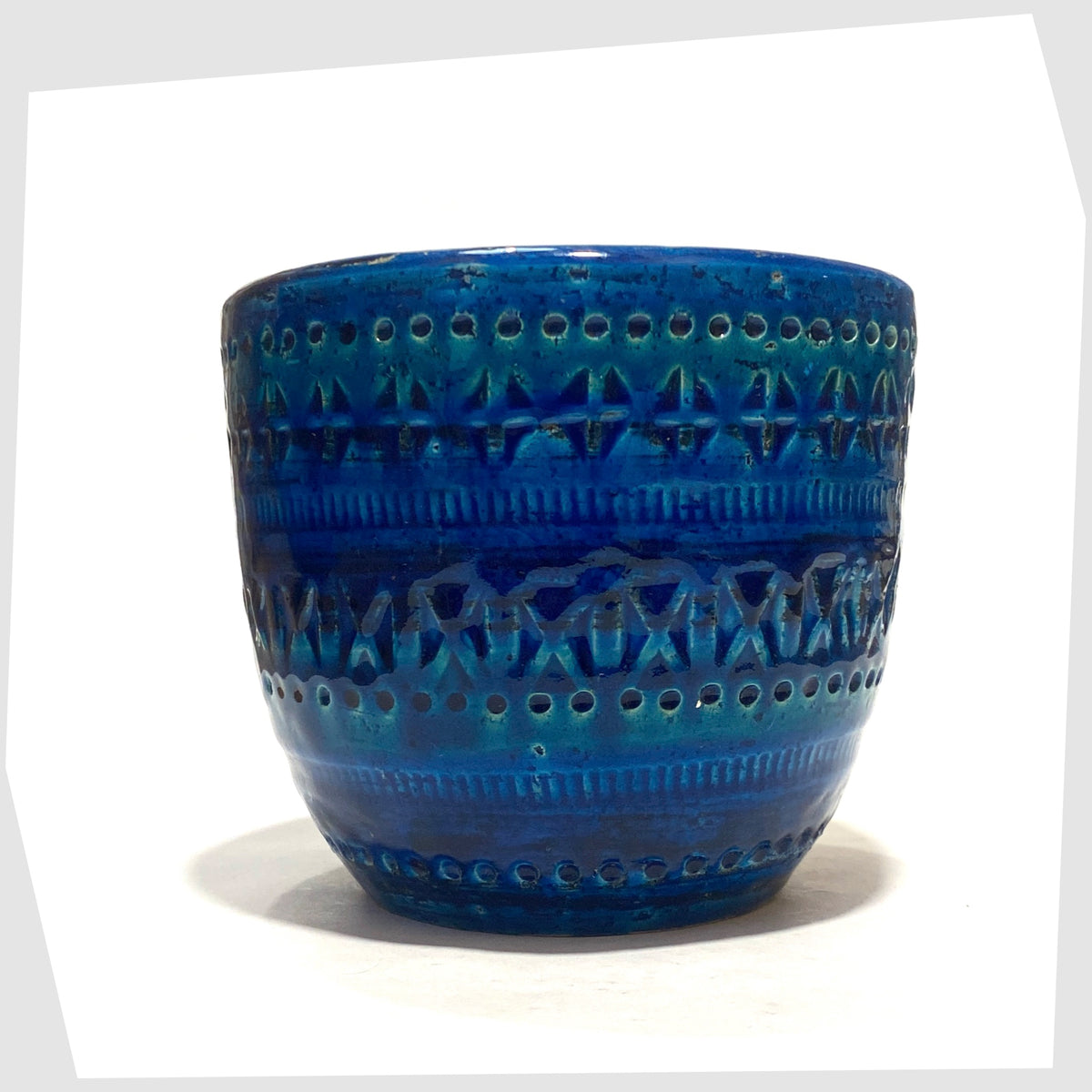 Bitossi Ceramiche Rimini Blue Planter, by Aldo Londi, in a rich blue glaze with an array of impressed markings, shown on a white background
