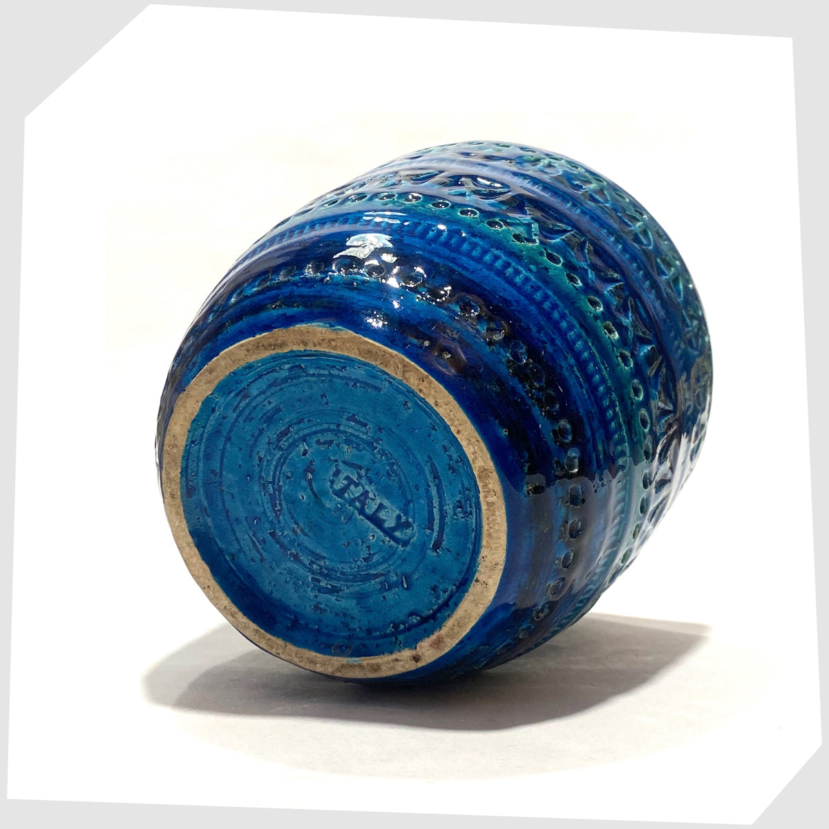Base of the Bitossi Rimini Blue Planter designed by Aldo Londi in a rich blue glaze with an array of impressed markings, shown on a white background