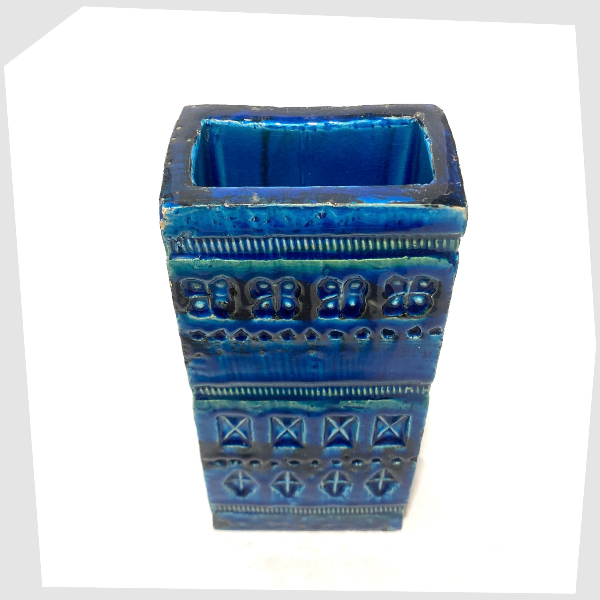 Top rim of the Bitossi Ceramiche Rimini Blu Brick Vase, designed by Aldo Londi, shown on a white background