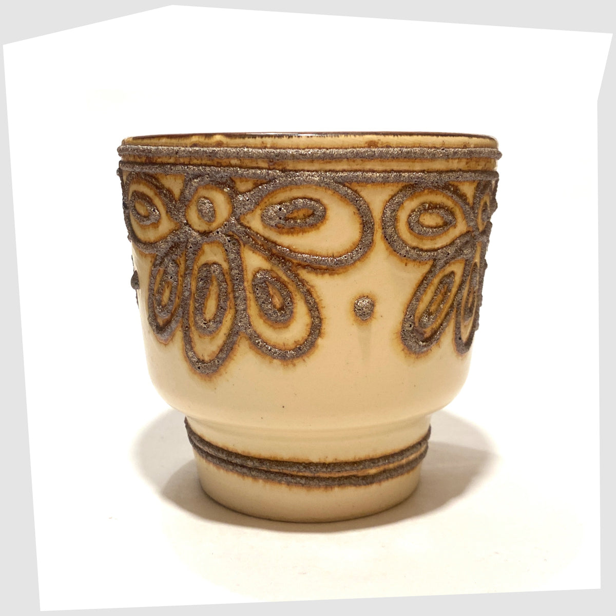 Mid-century B.P.F. Heffen Planter in a matte beige glaze with brown fat lava design, shown on a white background