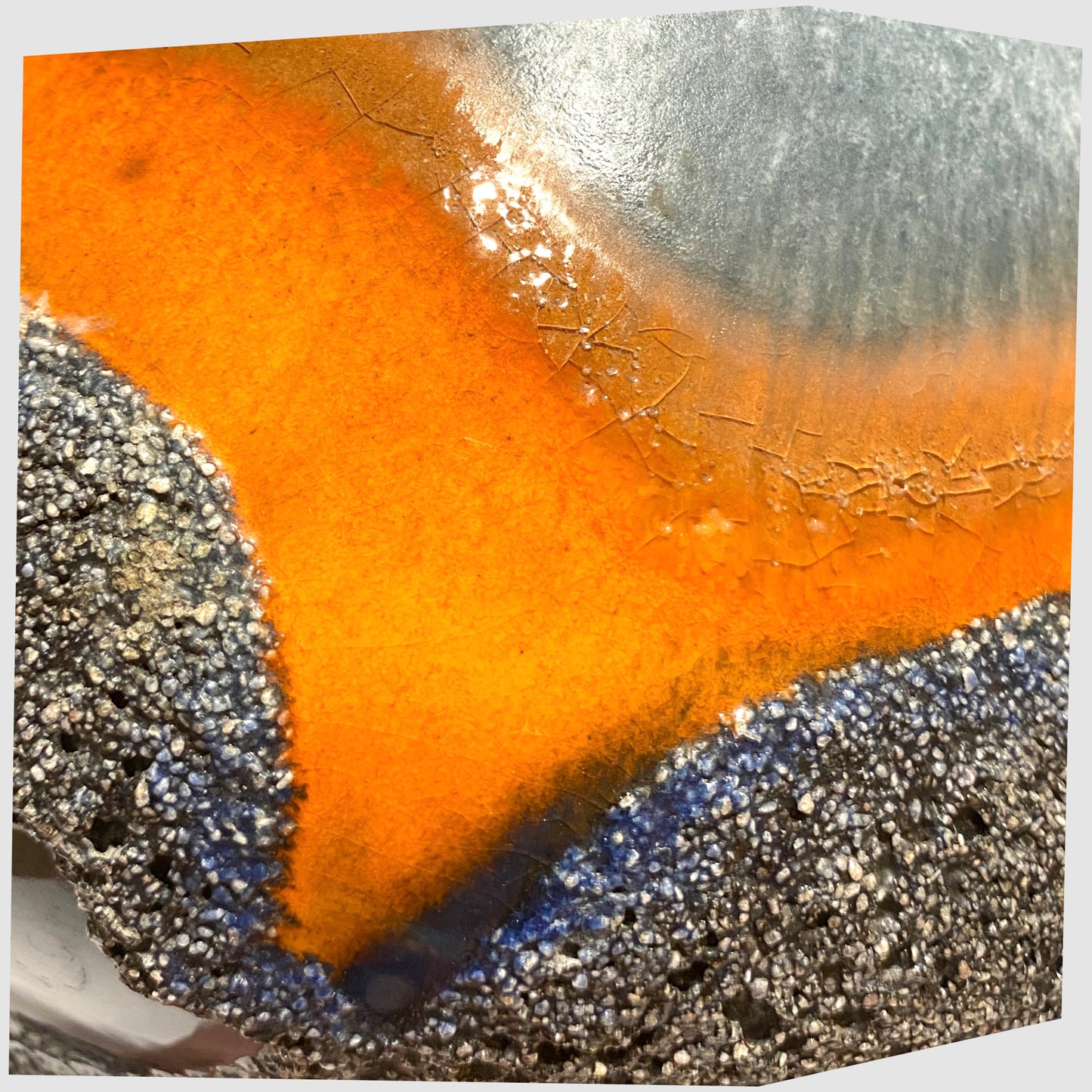 Glazing detail of the Carsten Tonnieshof Vase in asteroid form with bands of cool grey, volcanic orange and blue fat lava