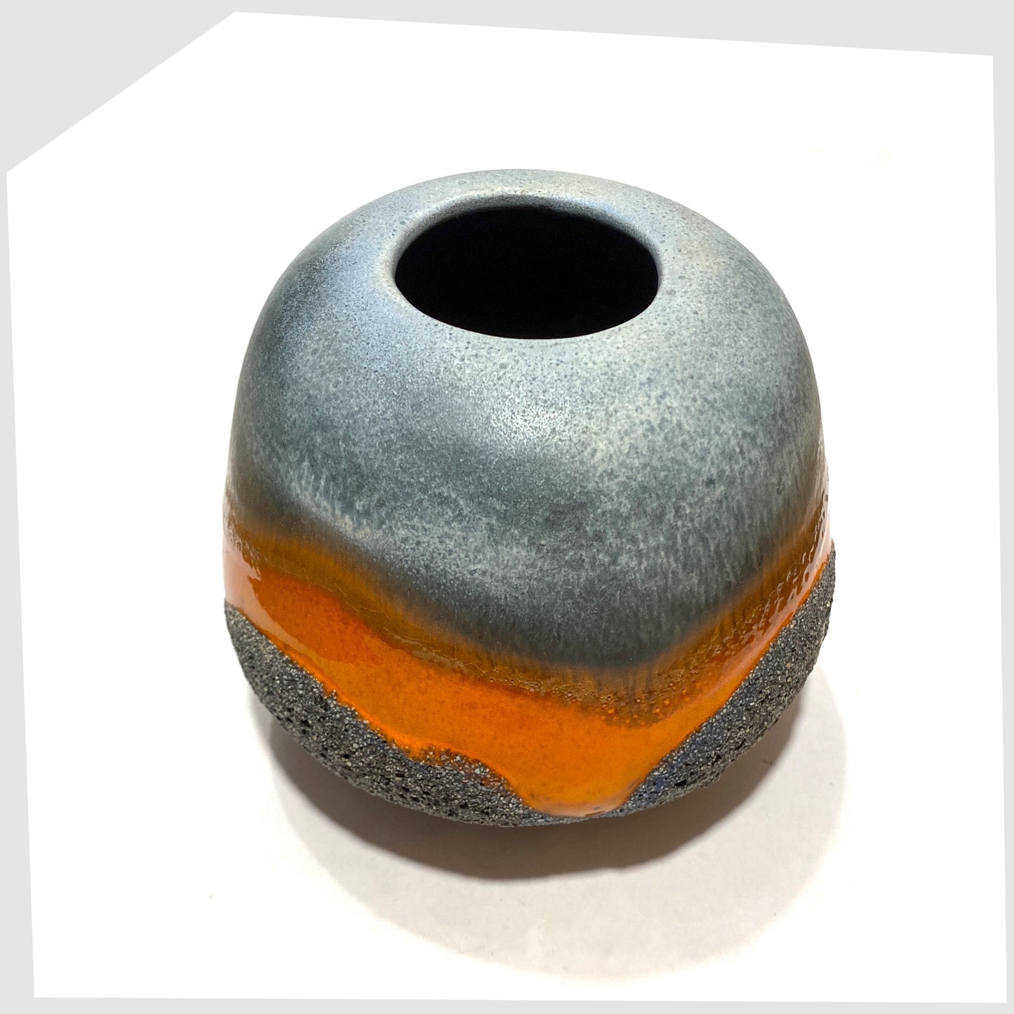 West German Art Pottery Carsten Tonnieshof Vase in asteroid form with bands of cool grey, volcanic orange and blue fat lava